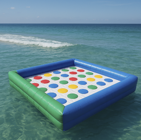 An inflatable giant Connect Four game floating on the ocean waters near the beach.