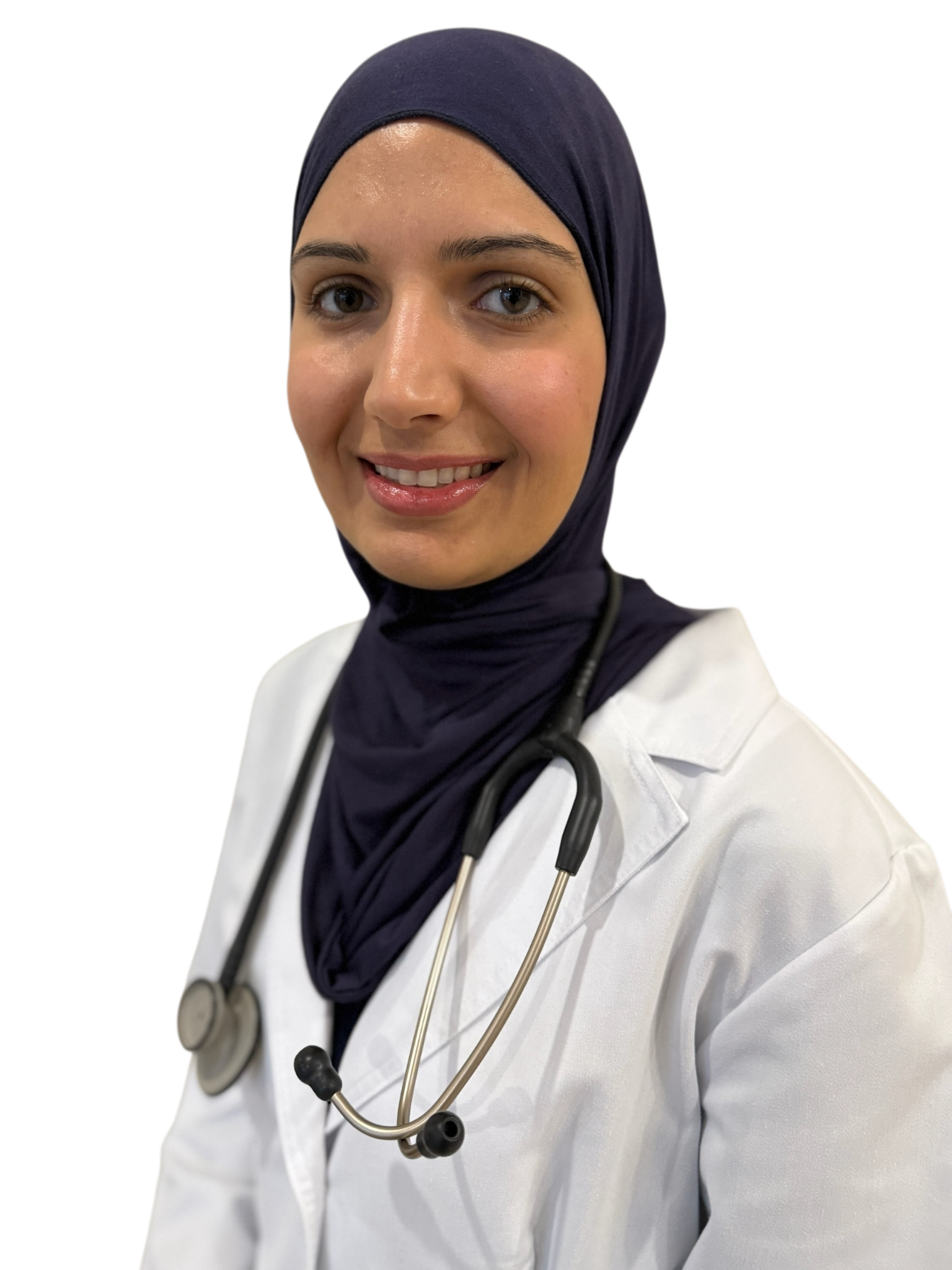 A smiling female doctor wearing a navy hijab, white lab coat, and stethoscope around her neck.