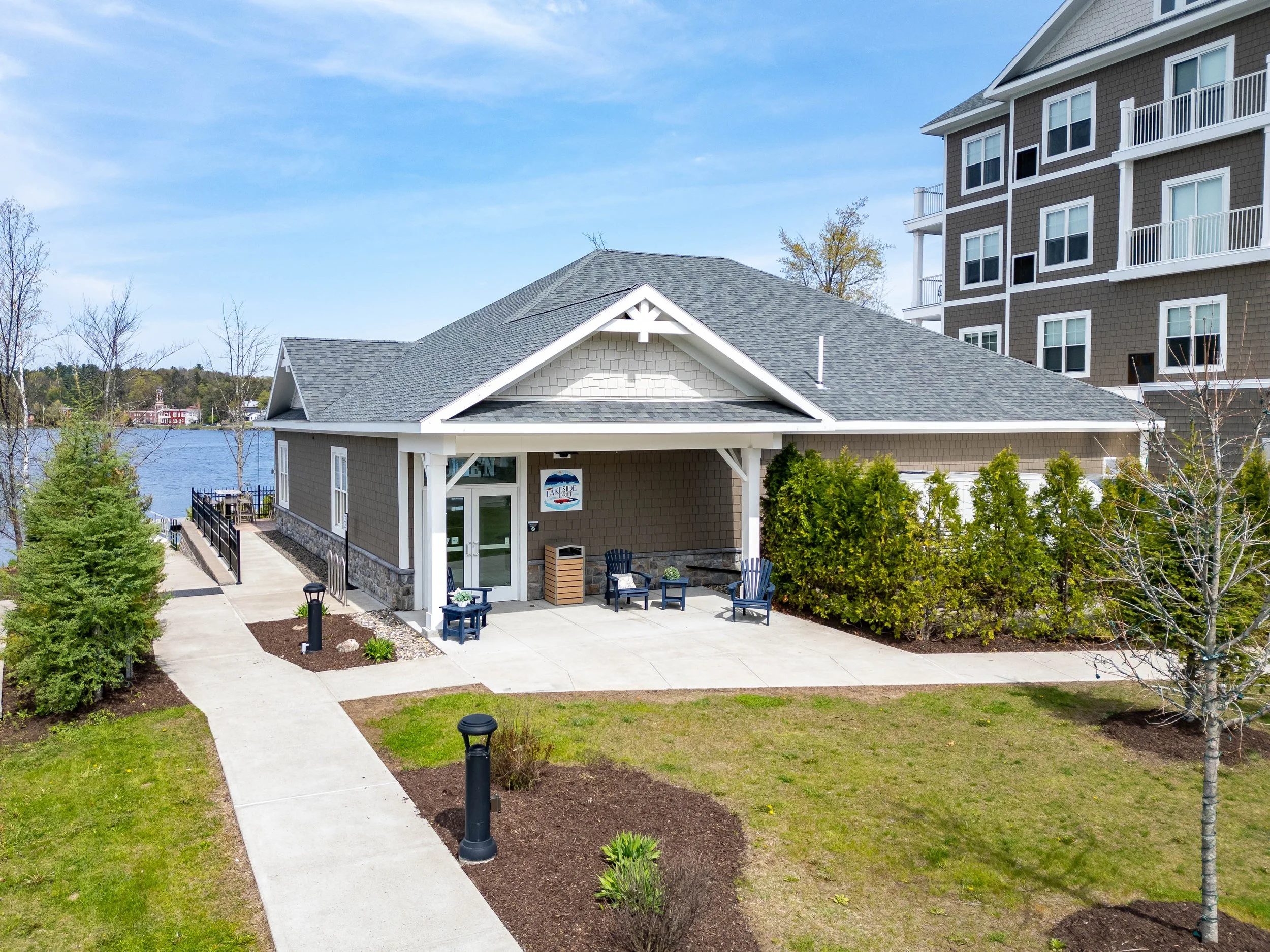 The front entrance of Lakeside Drift overlooking Lake Flower and connected to voco Saranac Lake- an IHG Hotel.