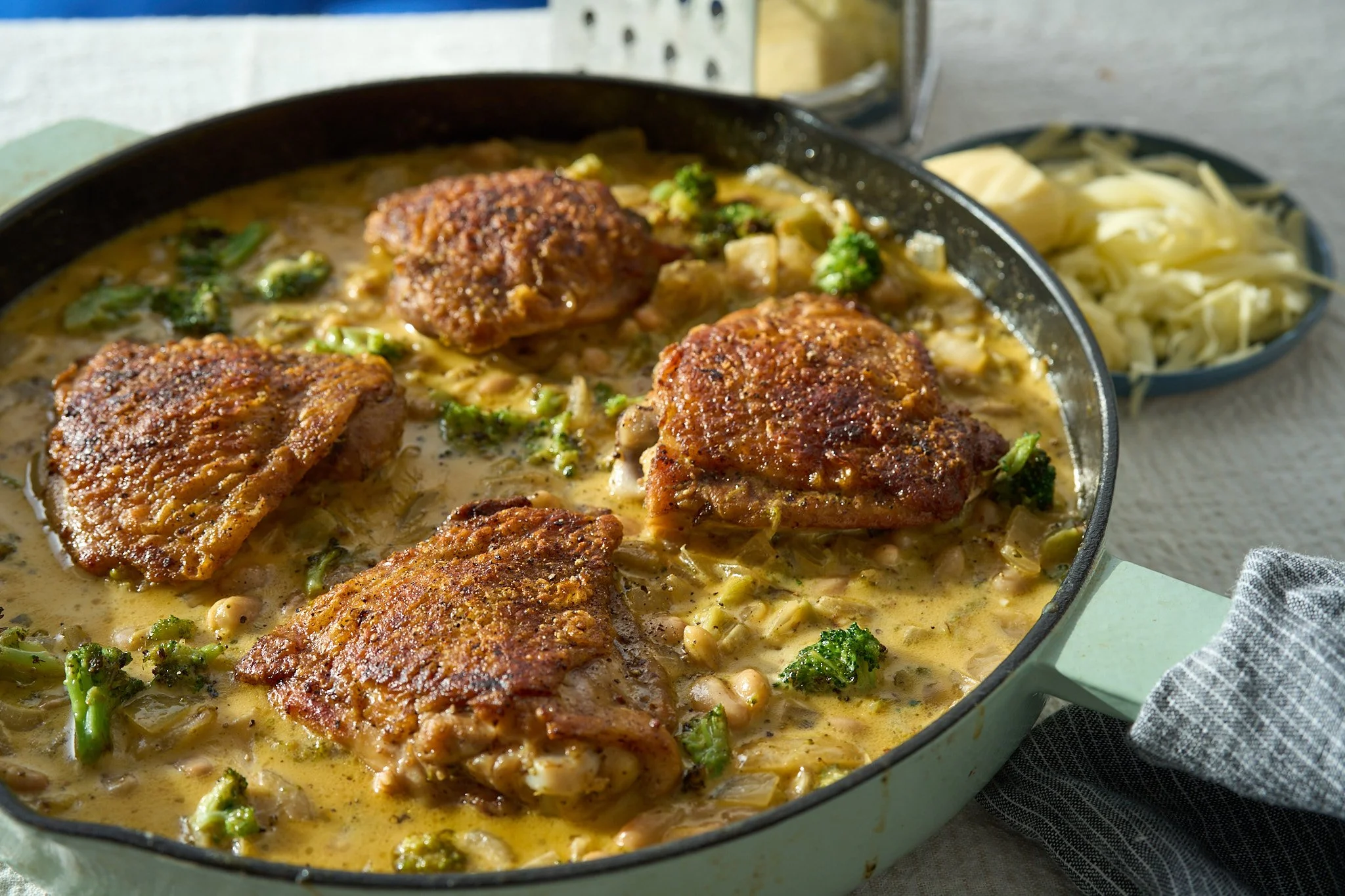 Crispy Chicken Thighs with Cheesy Broccoli Beans