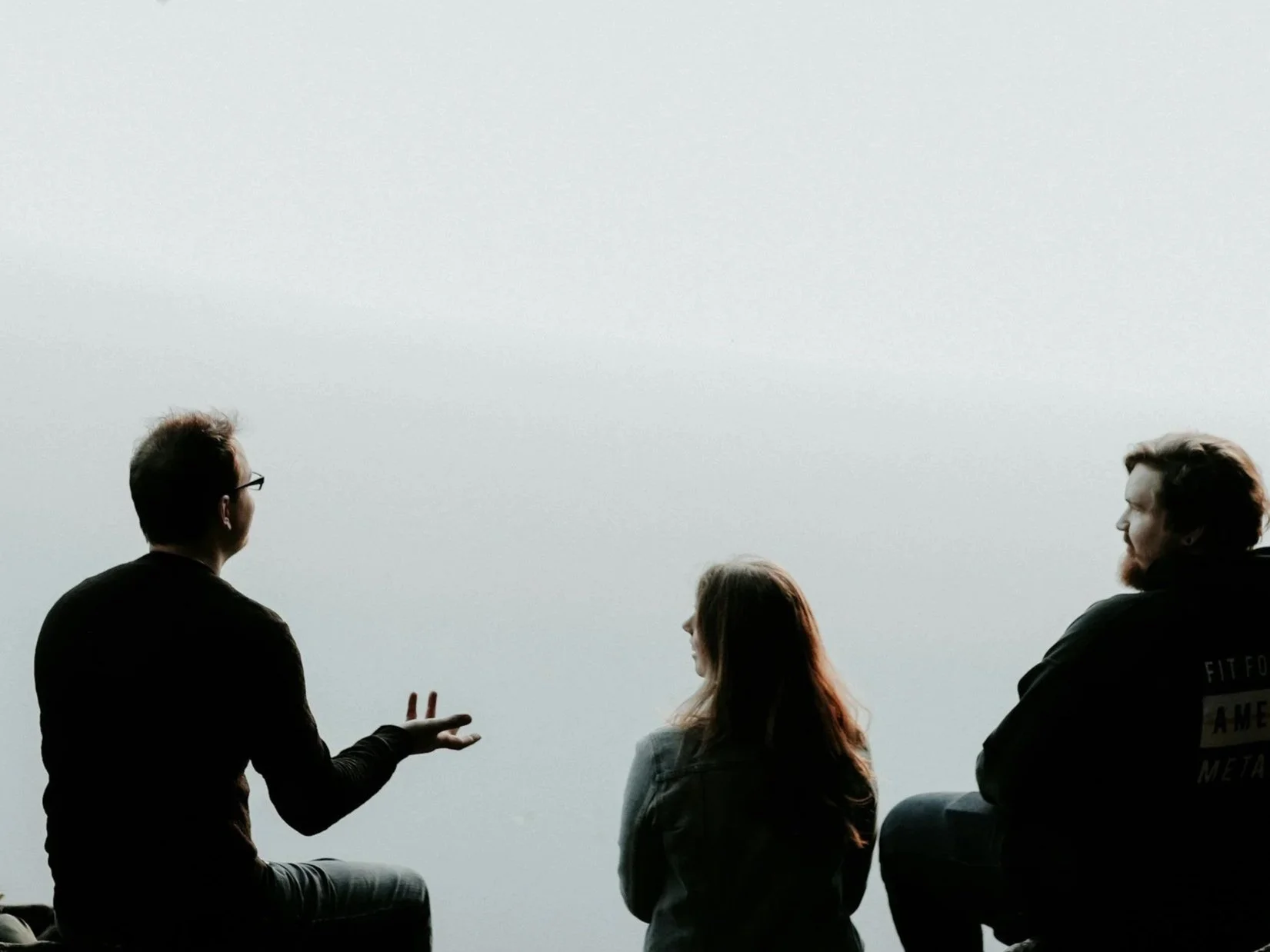 Three people connecting with each other