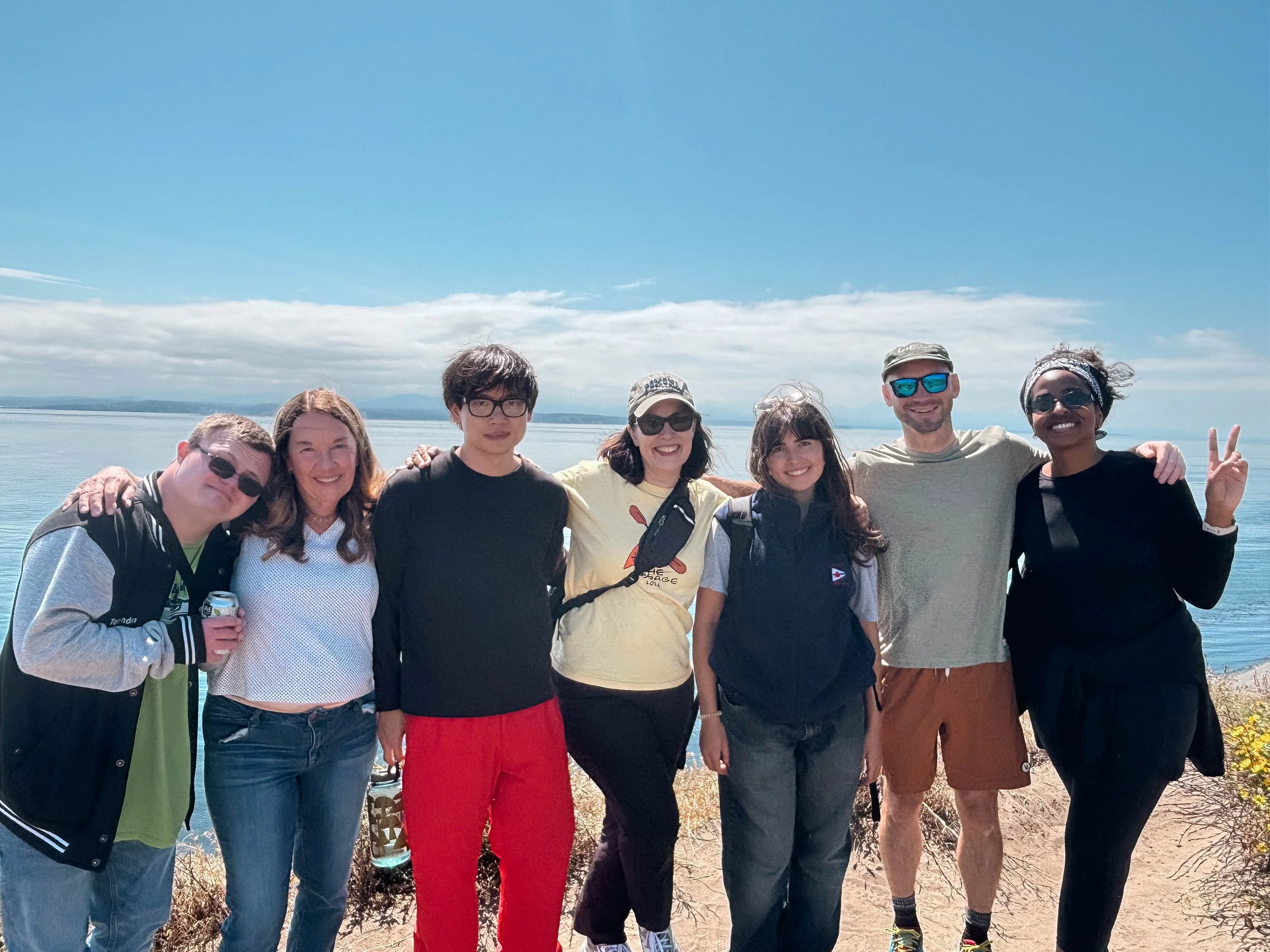 A group portrait of 7 people from Union Church along the bluffs at Camp Casey.