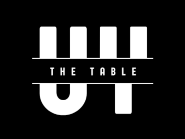 Black and white logo for the youth group, with a blocky type of a U & Y for Union Youth, and the name "The Table" written over it.