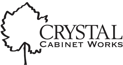 Logo for Crystal Cabinet Works featuring a stylized leaf and the company name.