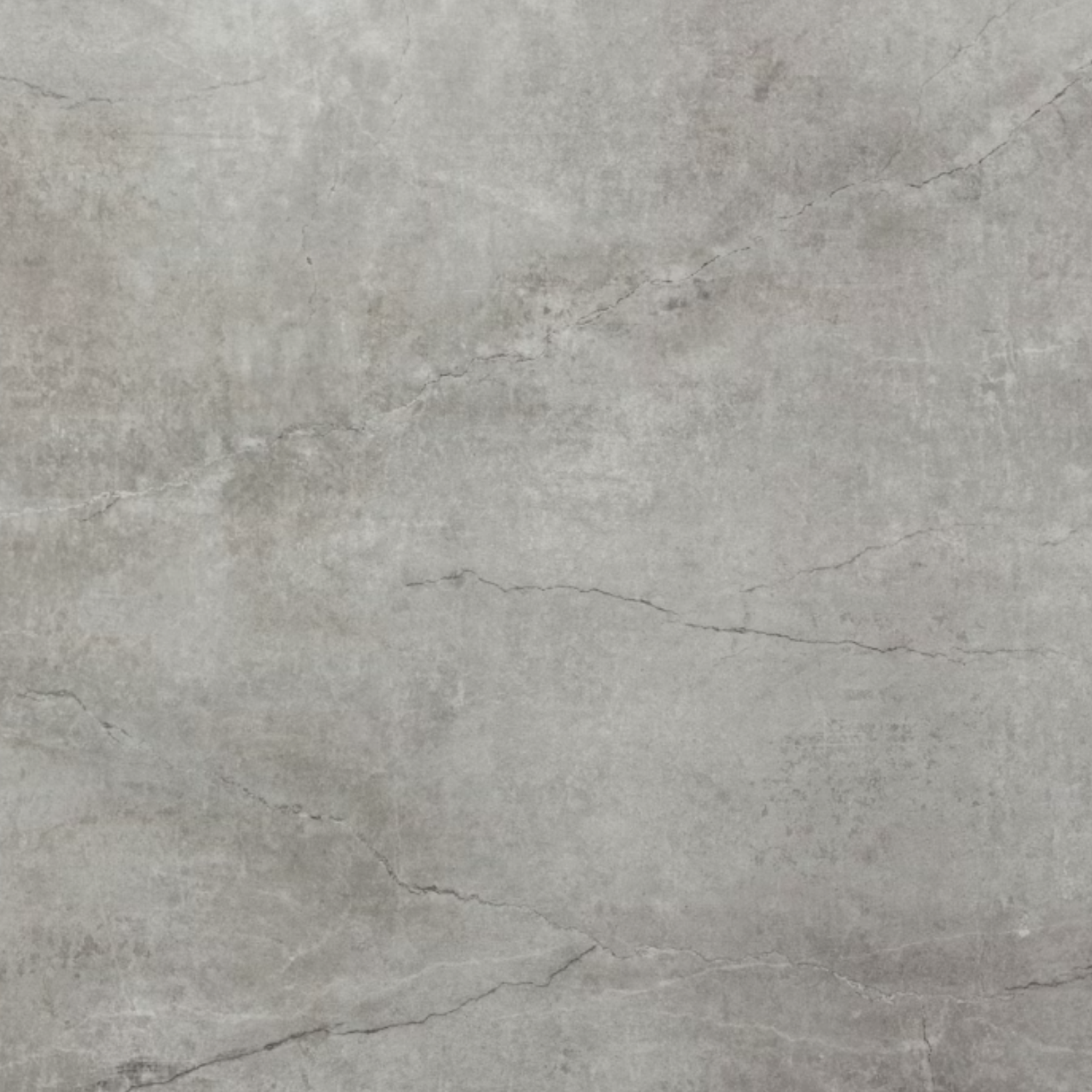 A gray concrete surface with visible cracks and texture.