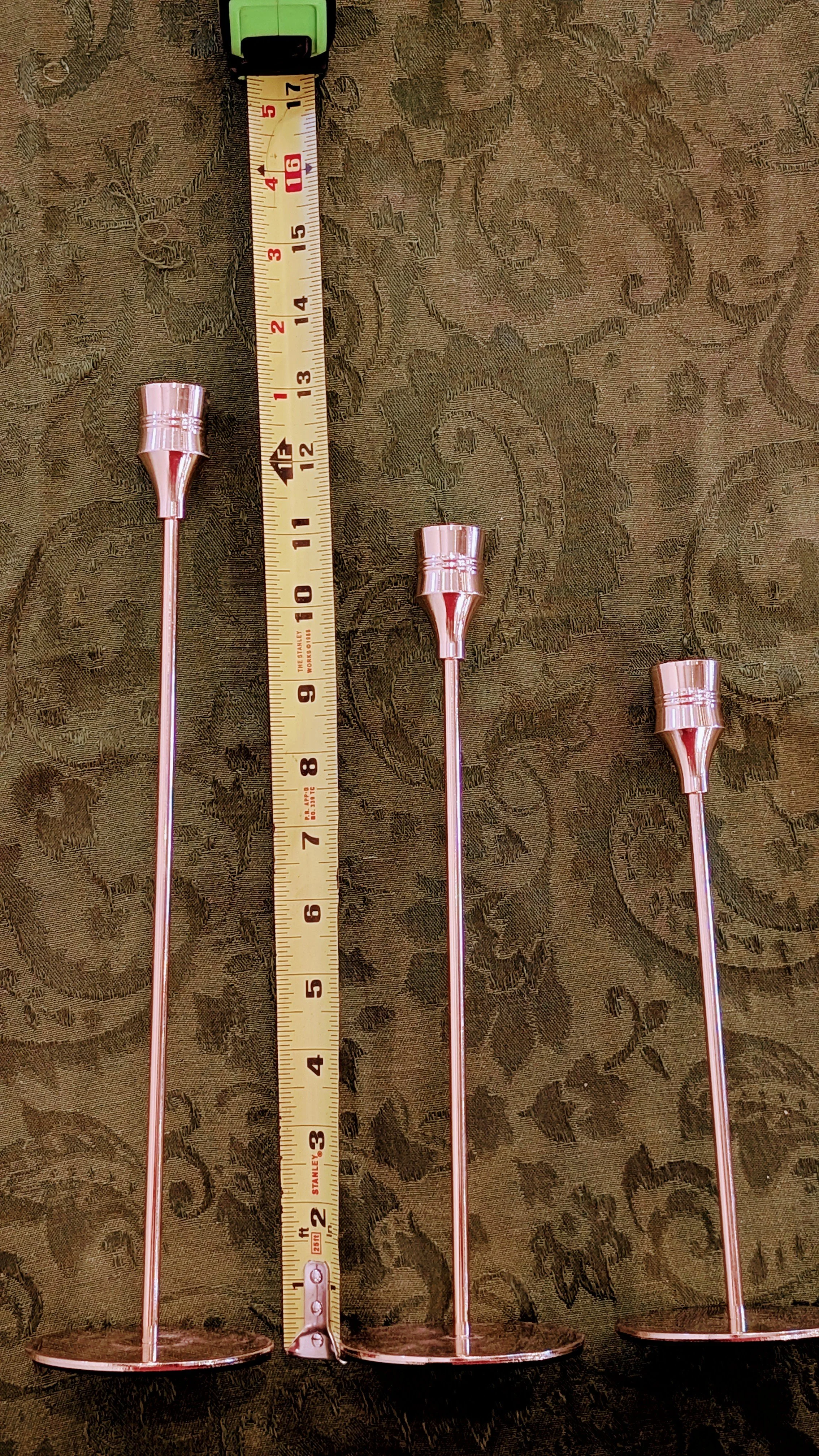 Gold candlesticks for tapers with ruler.jpg