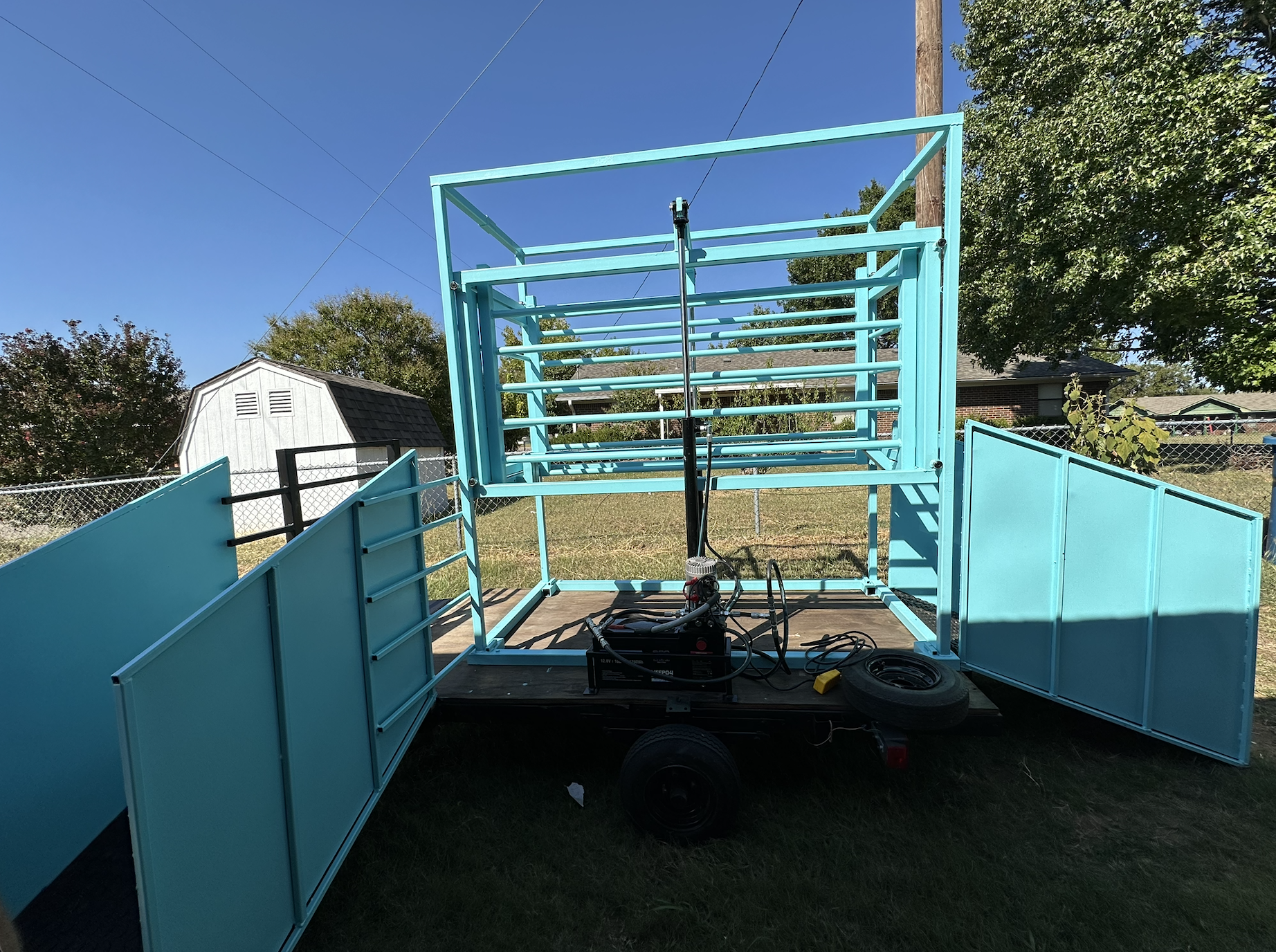 Hydraulic livestock chute during operational testing after fabrication and installation.
