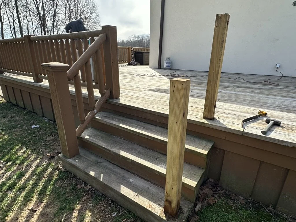 Welded steel railing posts and frame installed around an elevated outdoor patio.
