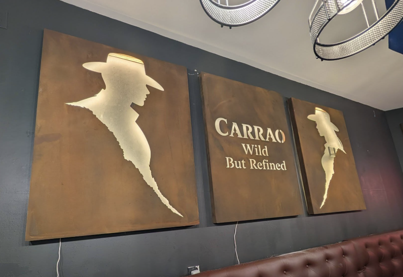 Custom CARRAO restaurant metal wall signs with rust finish and backlighting.