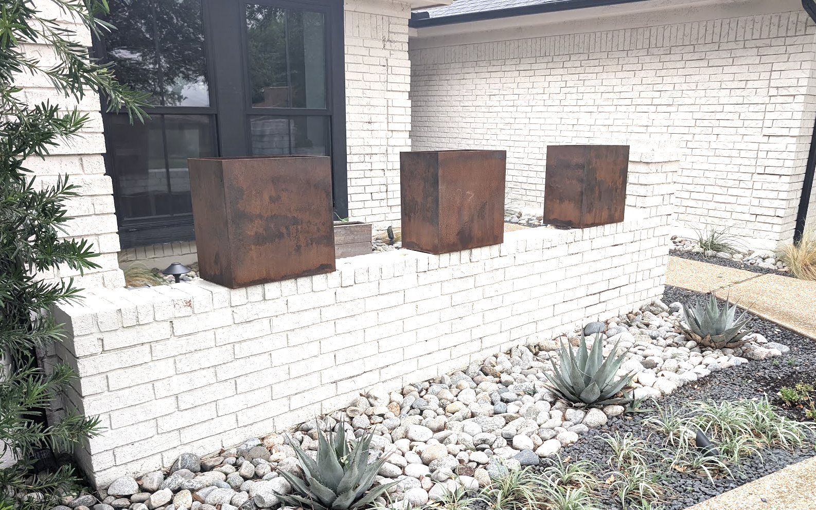 Custom Corten steel landscape planters installed at a North Texas home