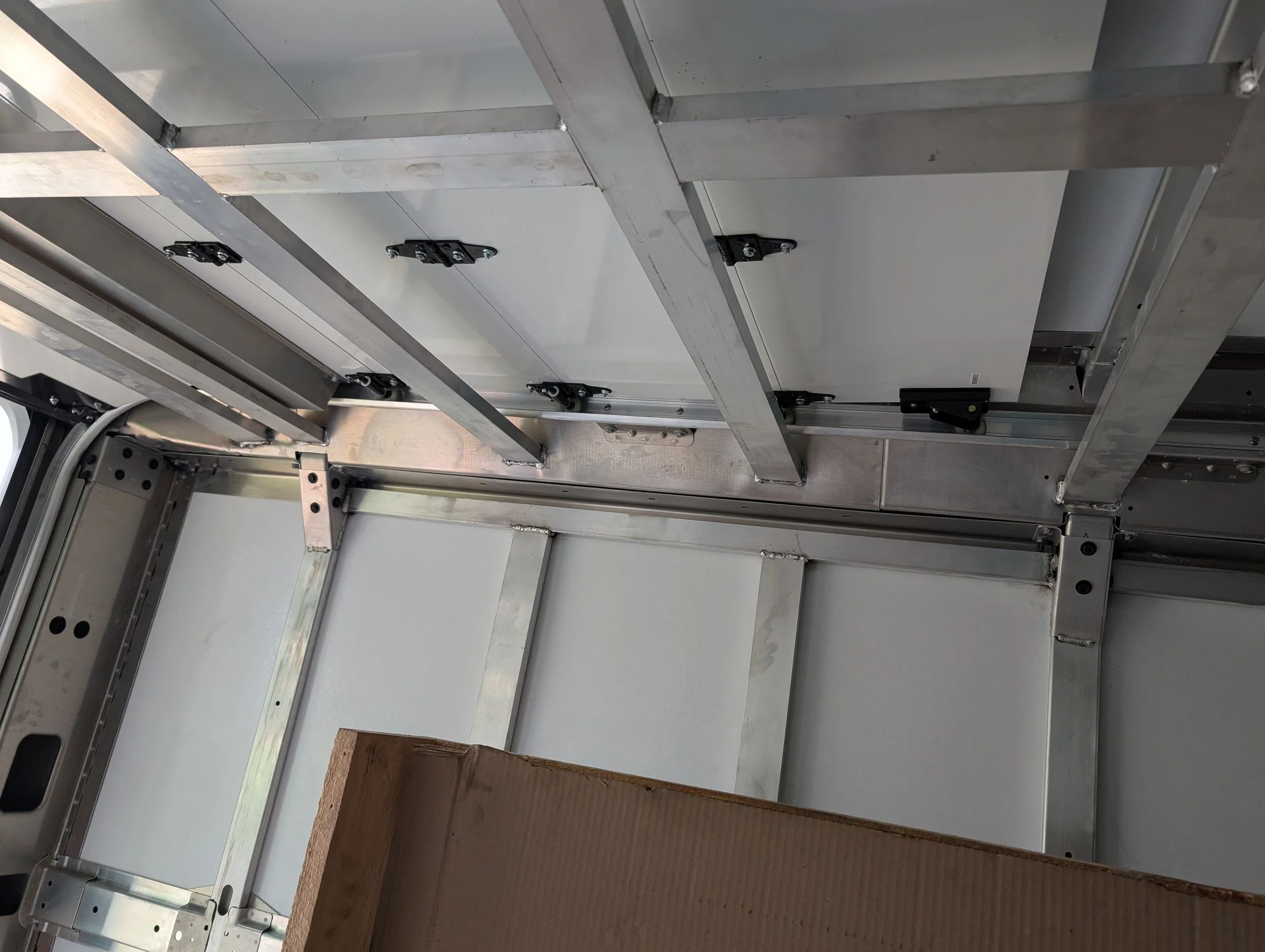 Custom aluminum serving window frame installed on an ice cream truck