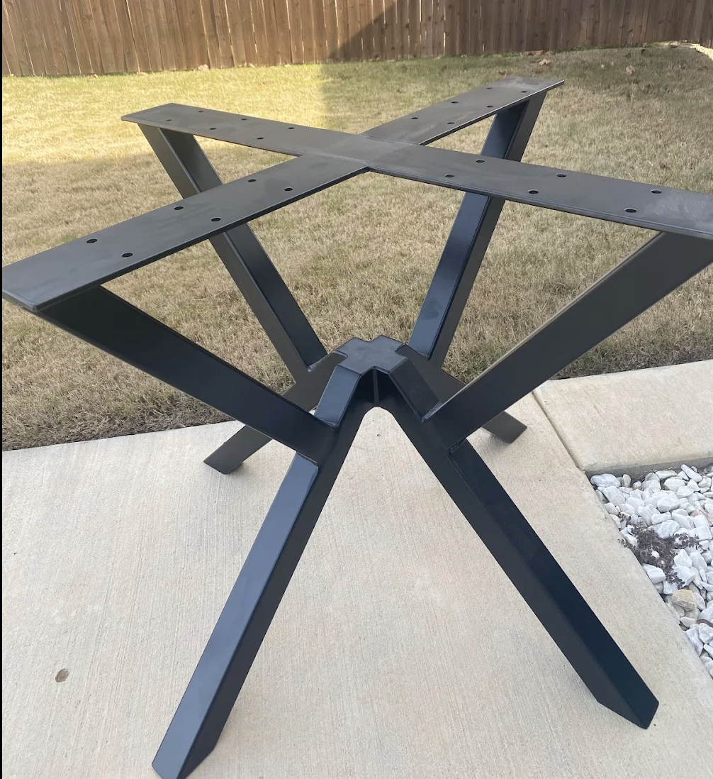A custom-fabricated steel table base designed for a round tabletop, built from heavy-duty steel and finished with a durable powder coat. The geometric pedestal design offers strong support, clean lines, and long-term durability for residential or com