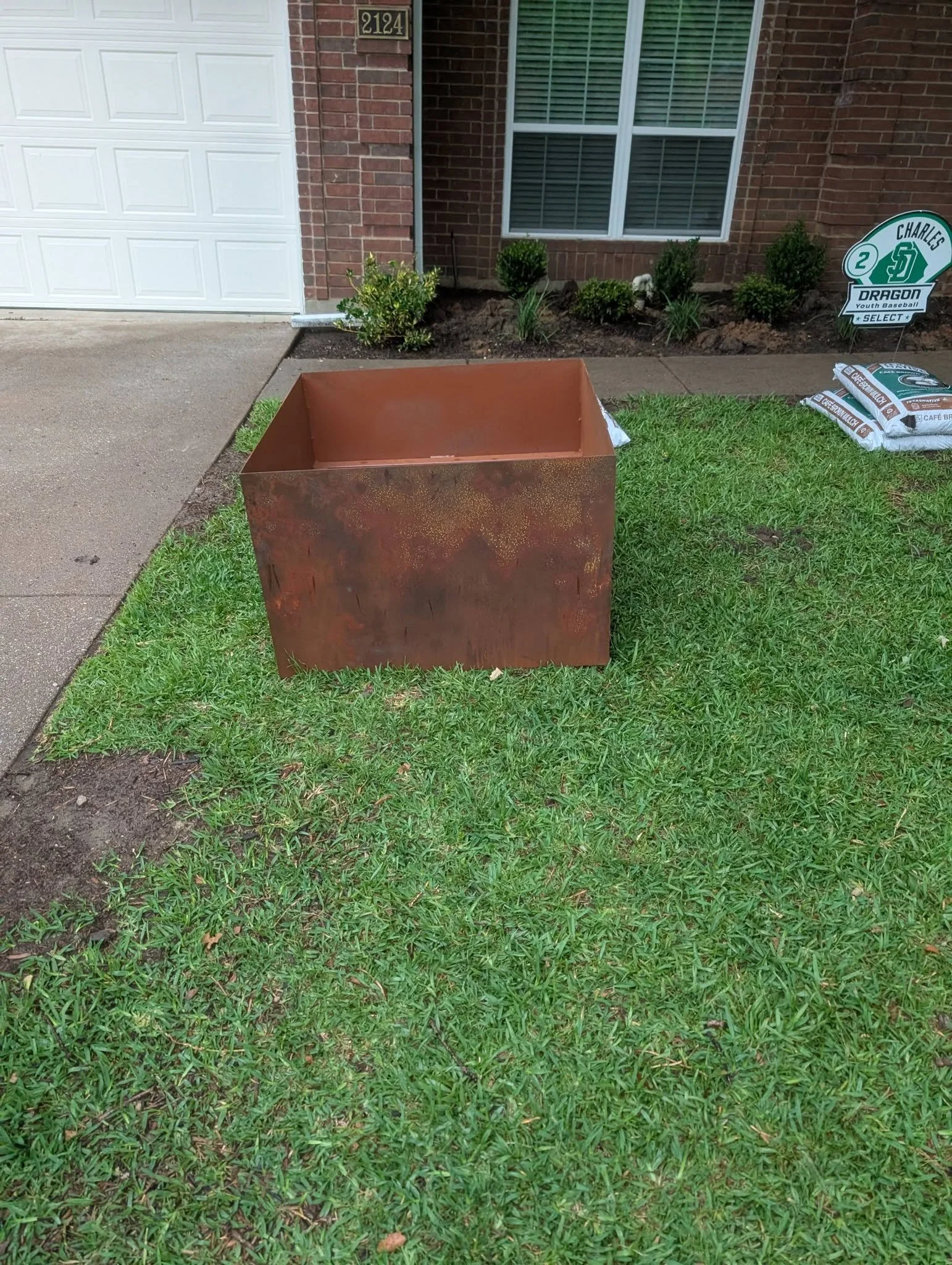 Large custom steel landscape planter fabricated and installed by JH Tig Works LLC.