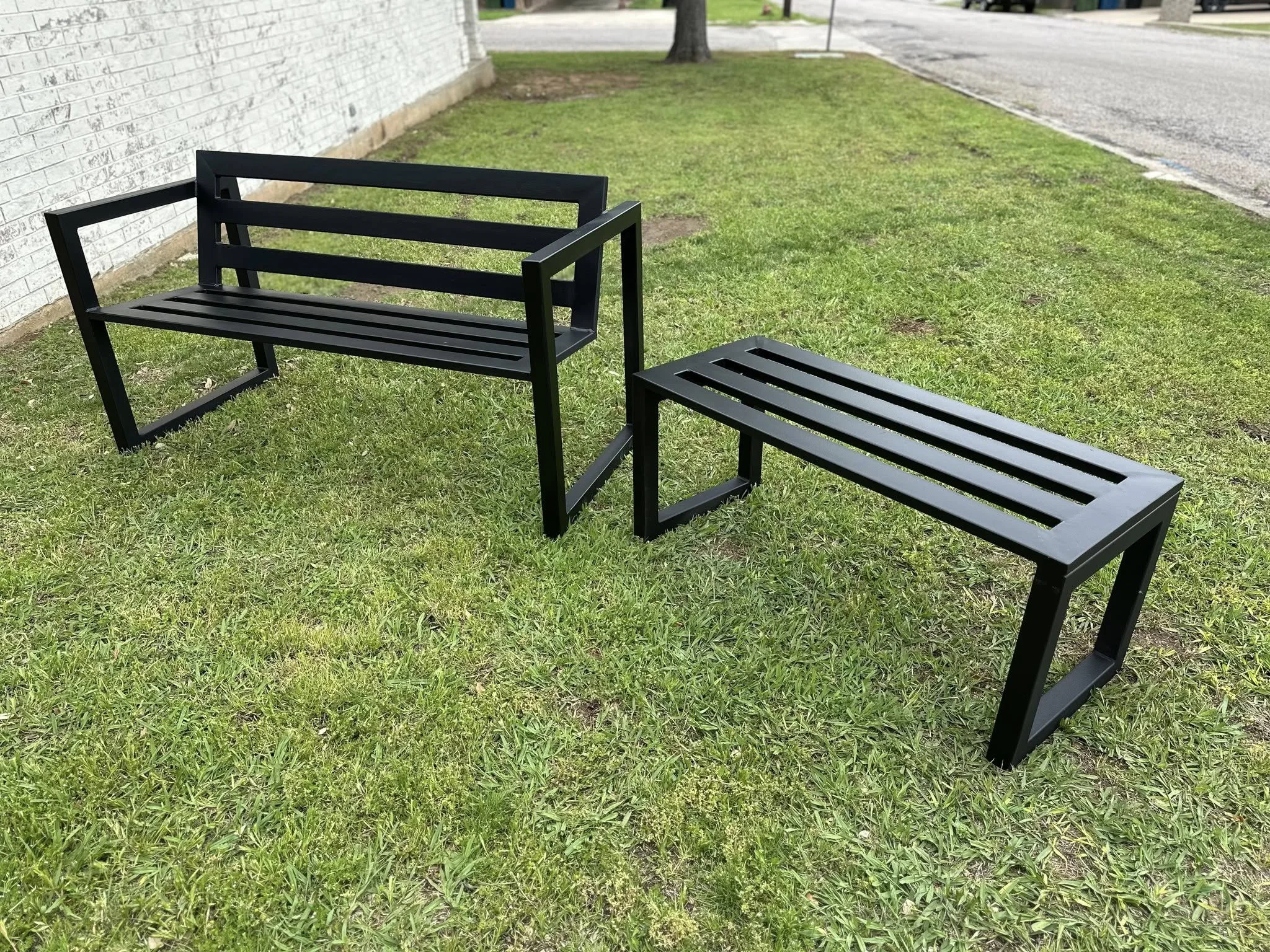 Matching custom outdoor steel benches with welded slat design fabricated by JH Tig Works LLC in North Texas