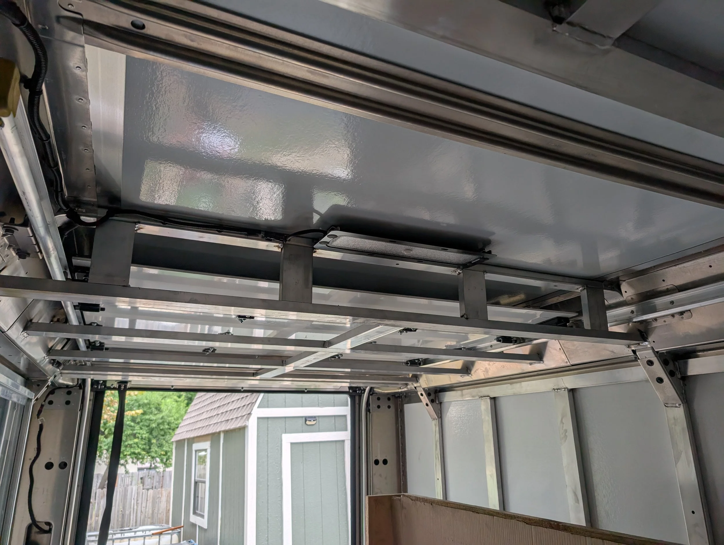 Close-up of welded aluminum framing fabricated for an ice cream truck serving window