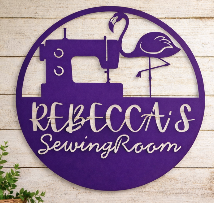 Custom purple sewing room metal sign with sewing machine, flamingo and personalized name, CNC plasma cut by JH Tig Works LLC.