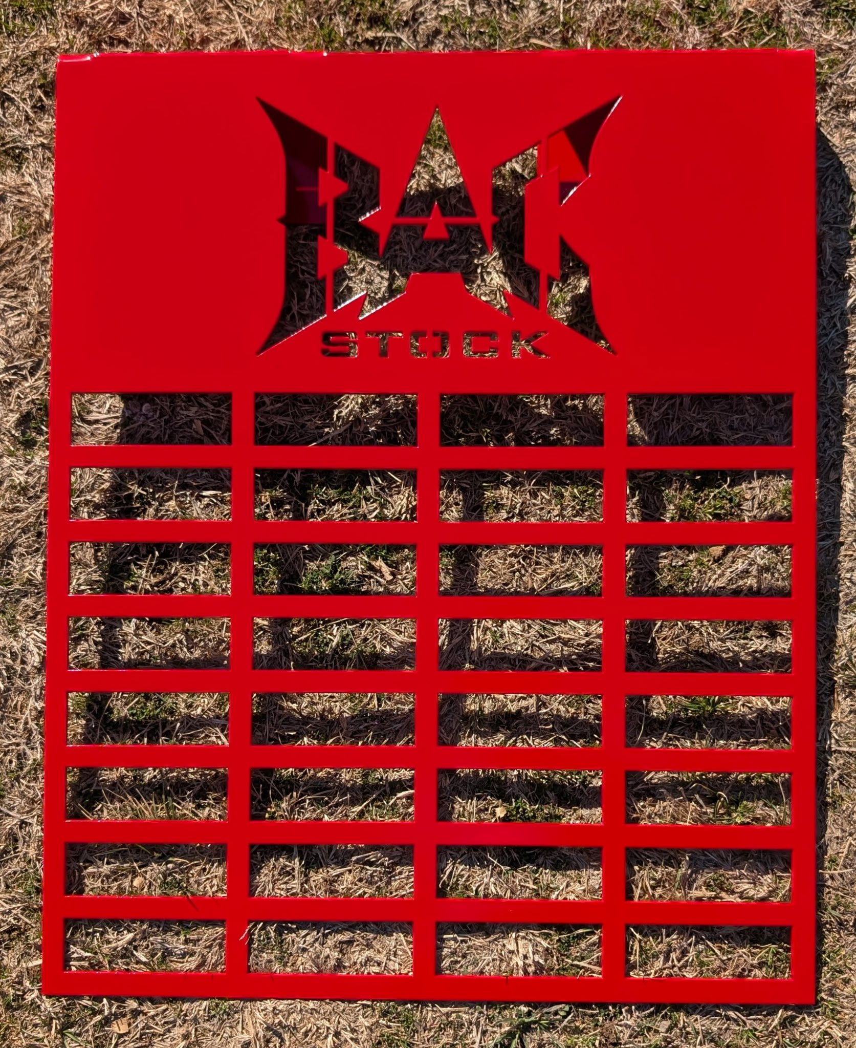 Custom red steel show animal feeder holder with personalized livestock design, CNC plasma cut and fabricated by JH Tig Works LLC.