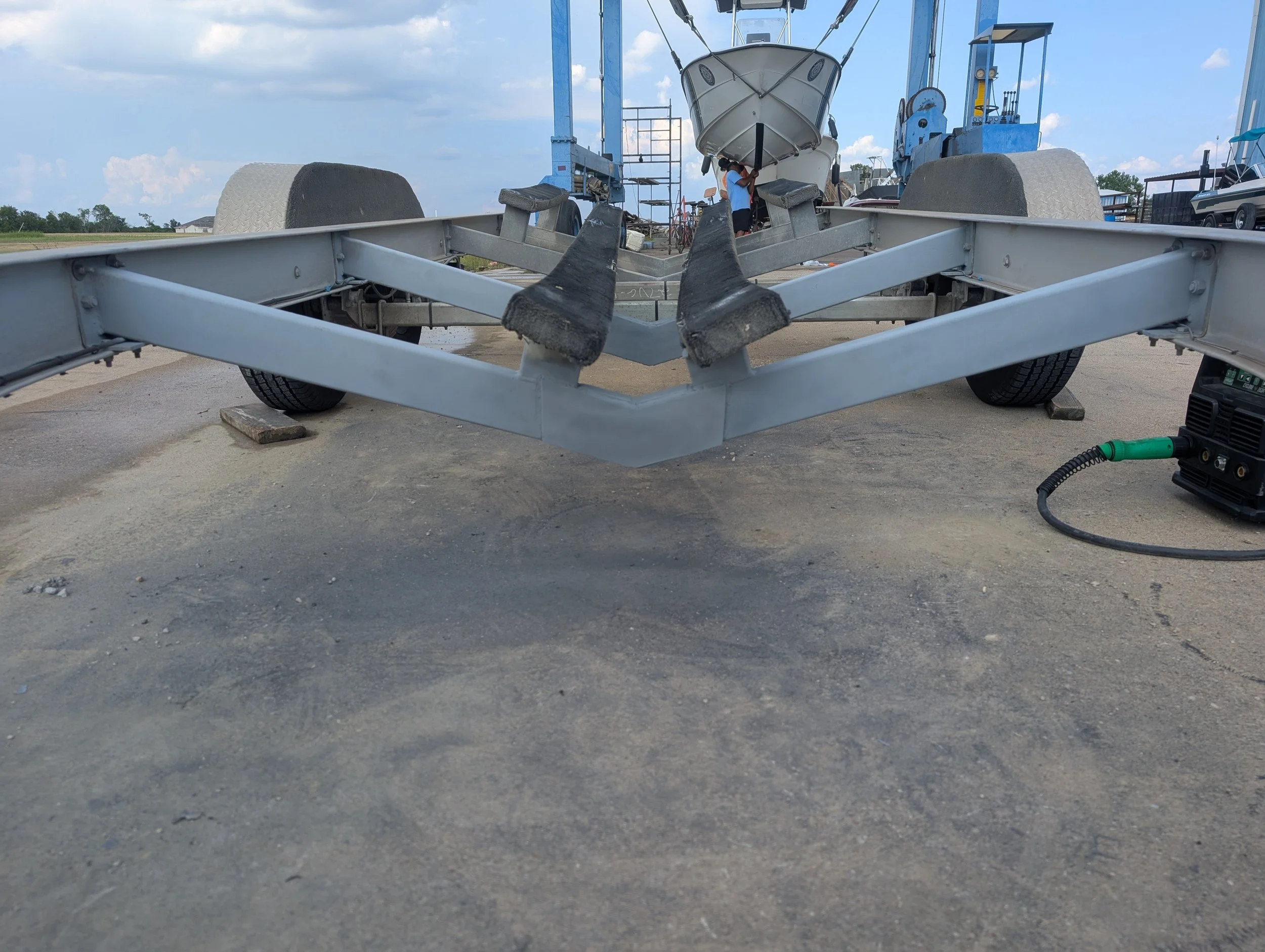 Completed aluminum boat trailer support beam repair after welding and reinforcement by JH Tig Works LLC.