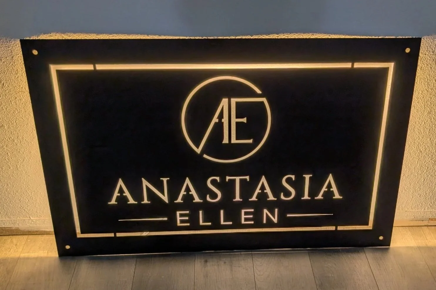 Custom backlit metal business sign for Anastasia Ellen.