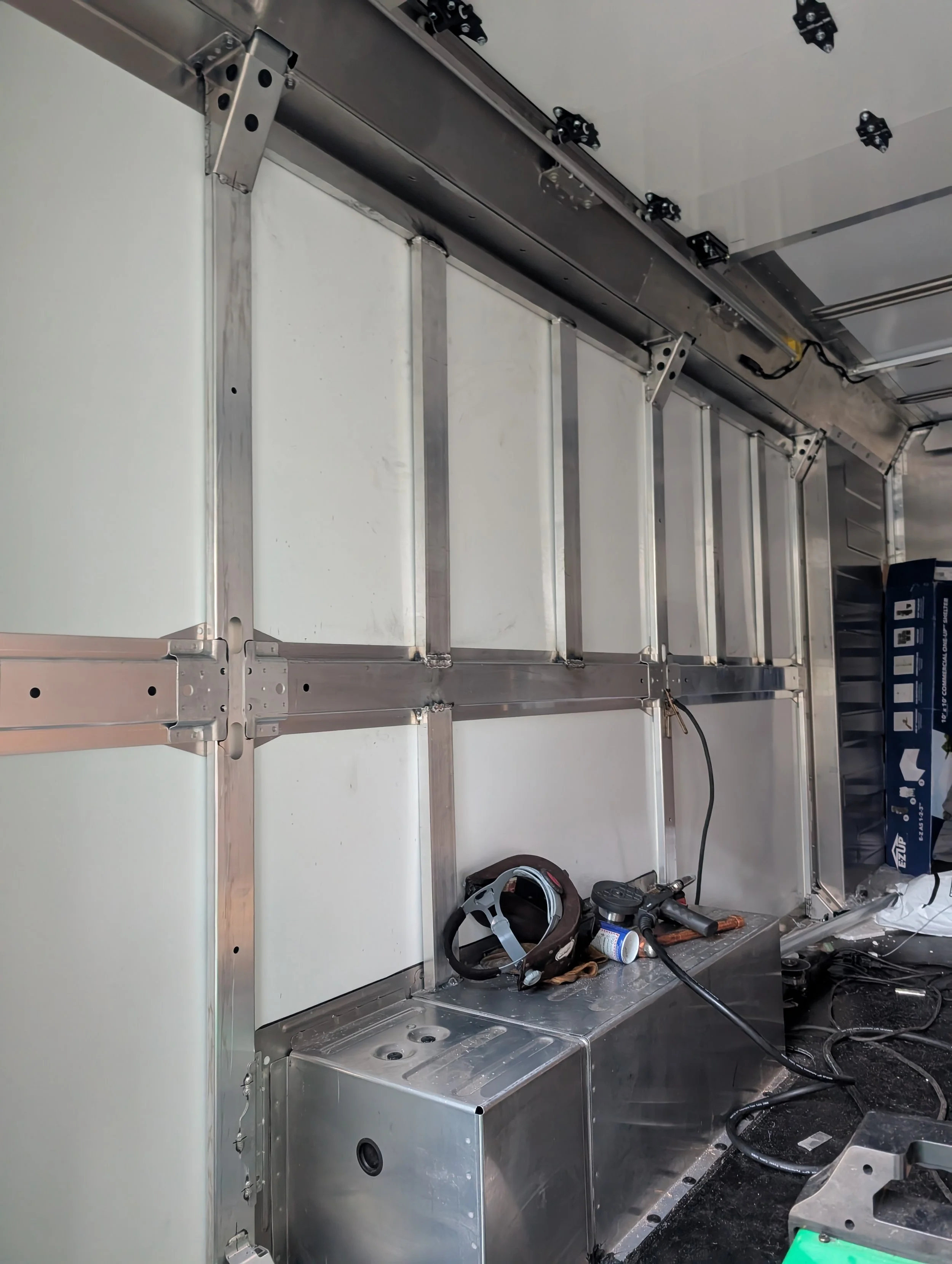 Aluminum serving window framework welded and fitted on a custom ice cream truck