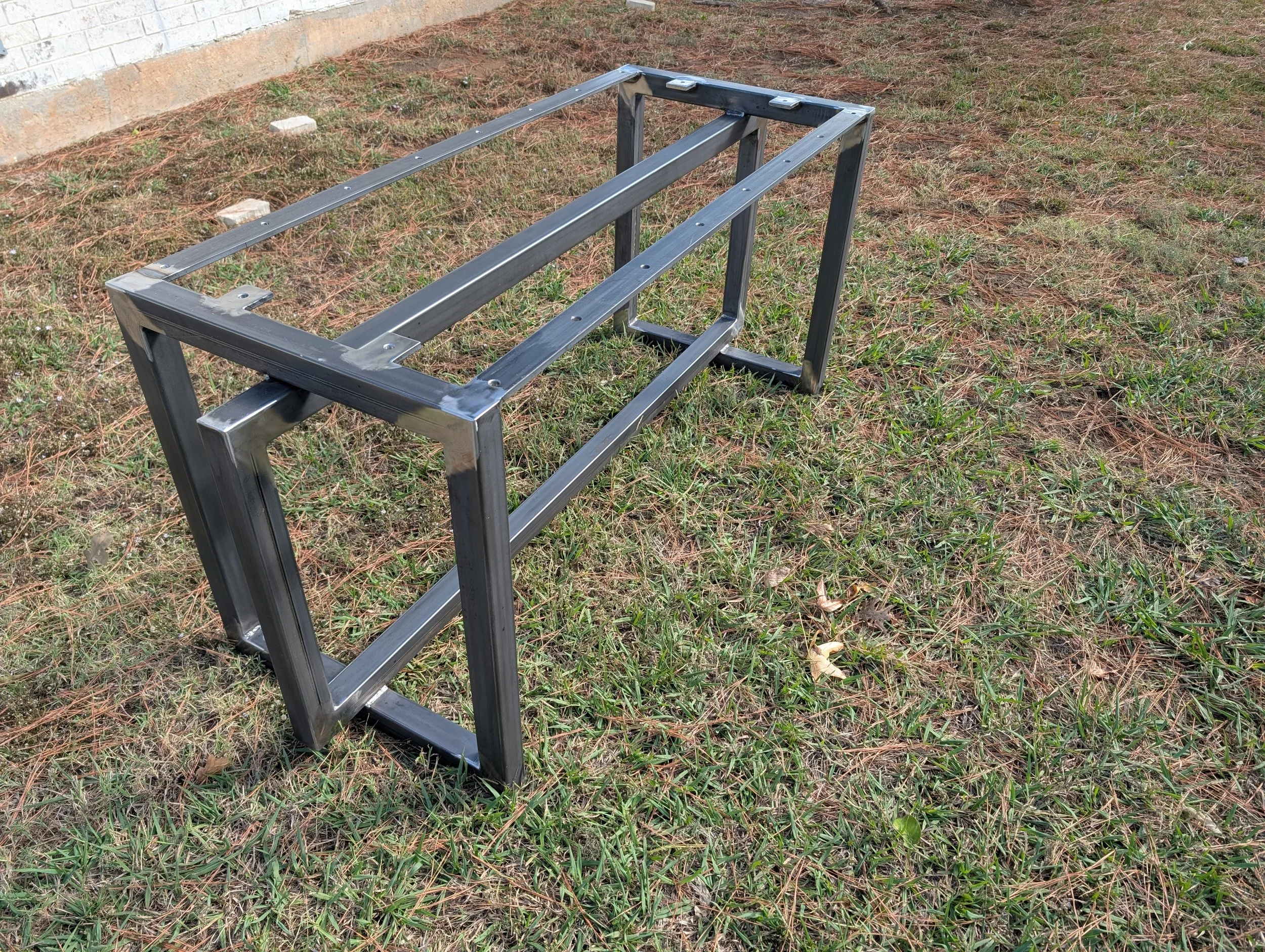 Modern custom metal table frame featuring a rigid rectangular design and clean welds. Engineered for durability and proper load support for dining tables, desks, and custom furniture projects.