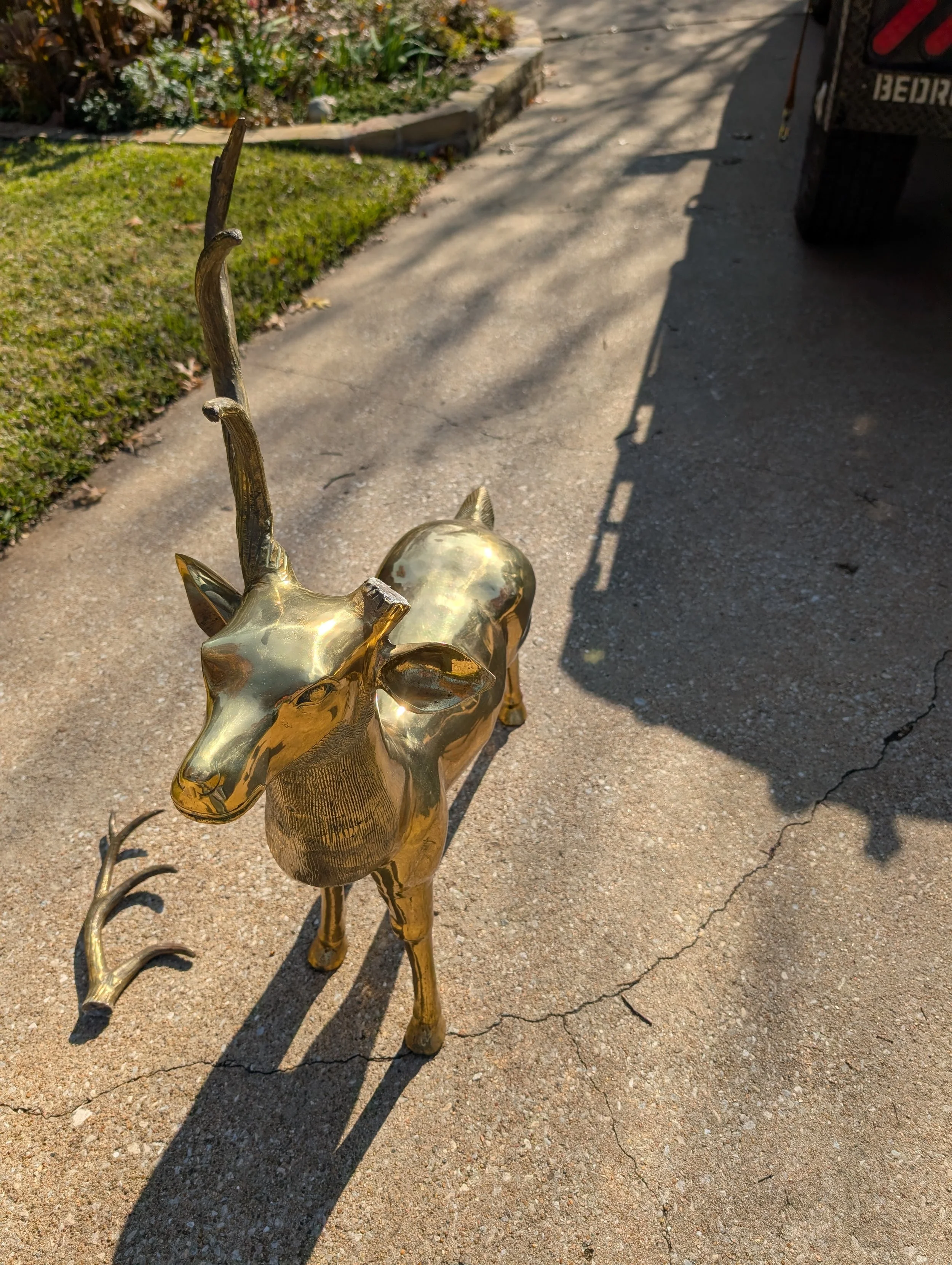Damaged brass deer sculpture before brass welding and antler repair by JH Tig Works LLC in North Texas