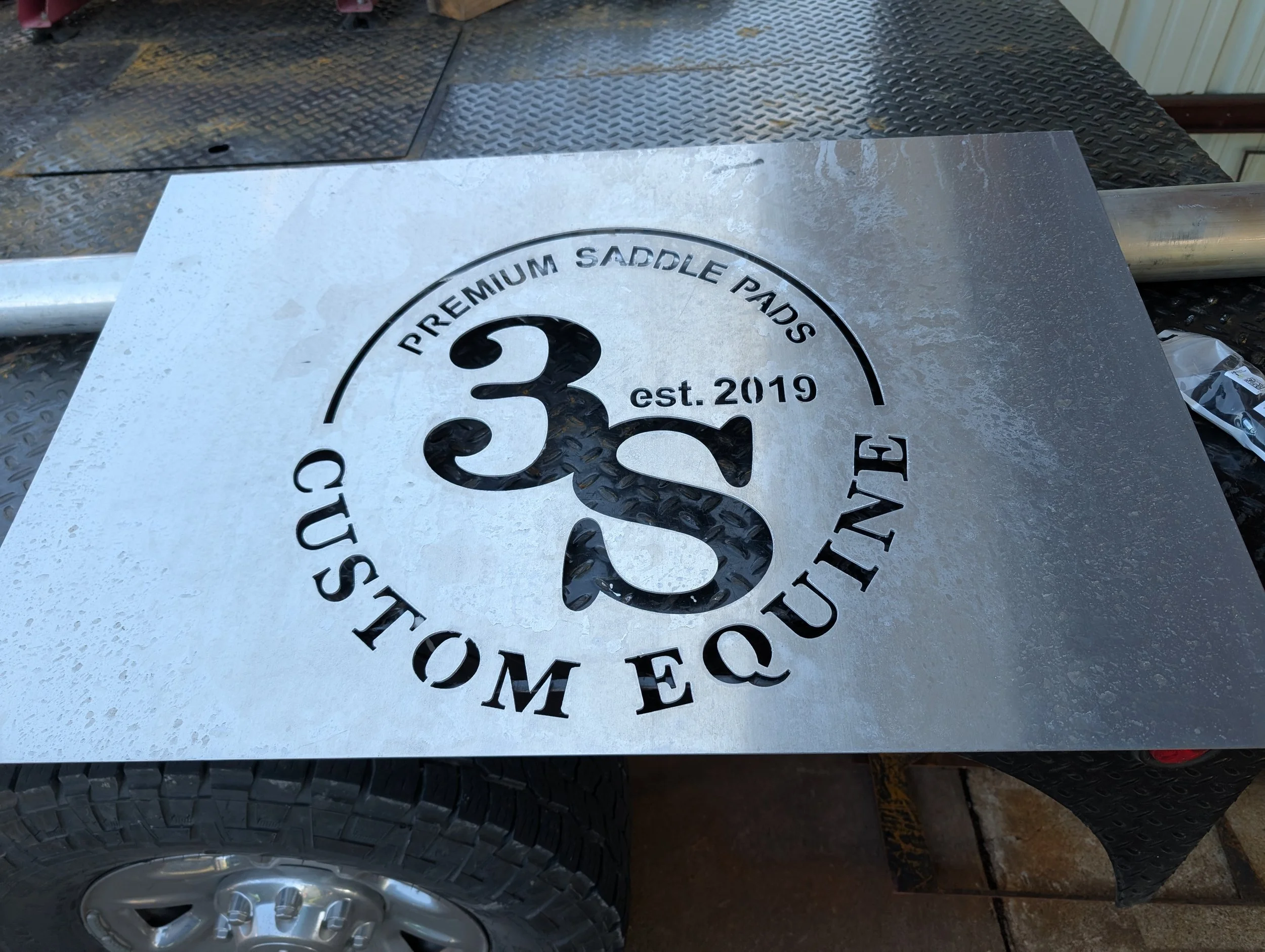 CNC plasma-cut custom metal sign for 3S Custom Equine Premium Saddle Pads.