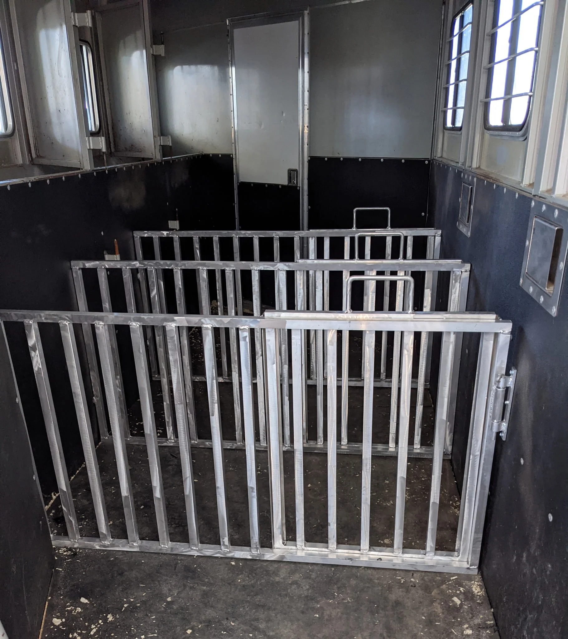 Custom aluminum livestock trailer gates fabricated and TIG welded by JH Tig Works LLC in Collinsville, TX.