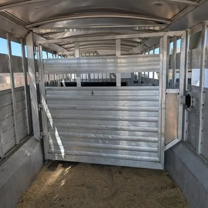 Custom aluminum horse trailer interior components fabricated for a livestock trailer conversion.
