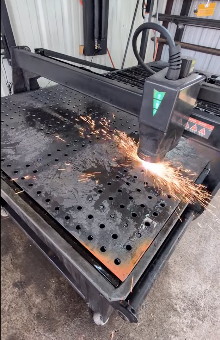 CNC plasma cutting steel for a custom metal fabrication project at JH TIG WORKS in North Texas