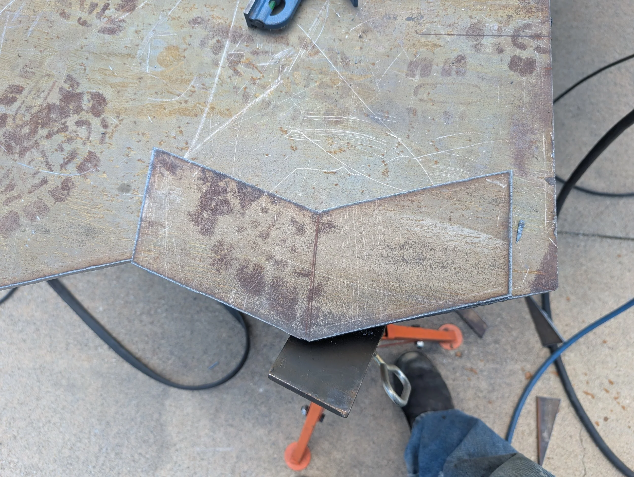 Custom reinforcement plate fabricated for an aluminum boat trailer frame repair.