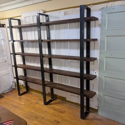 Custom steel and wood shelving unit with welded metal frame fabricated by JH Tig Works LLC in North Texas