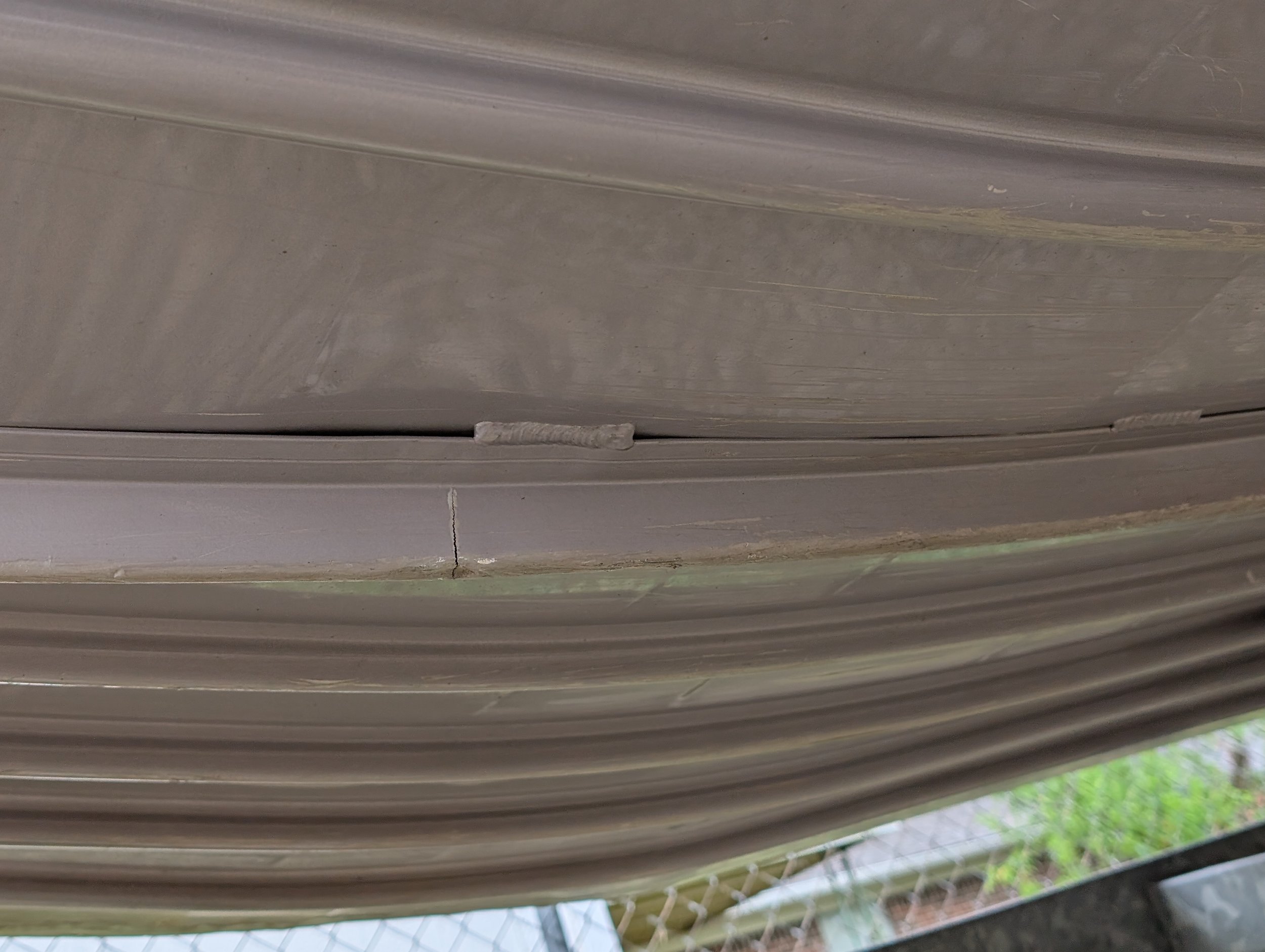 Cracked aluminum boat hull before welding repair by JH TIG WORKS in North Texas