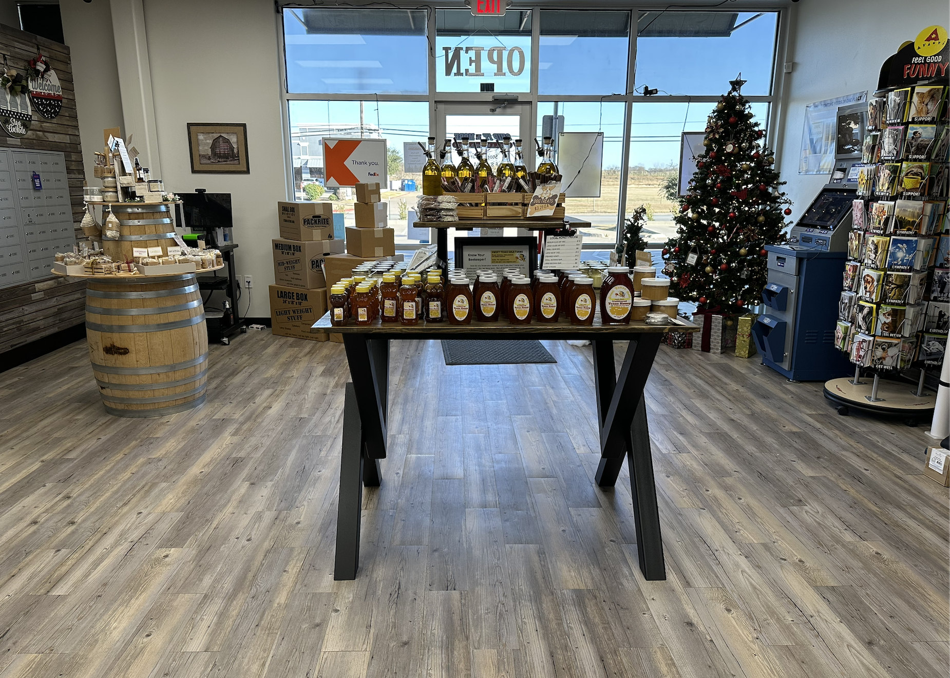 Finished custom display table featuring steel legs and a solid wood top, designed for commercial use and high-traffic retail environments.