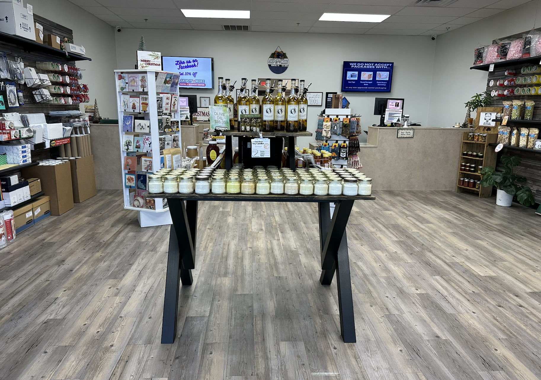 Front-facing view of a custom-built steel and wood retail display table showcasing durable fabrication and a clean, professional presentation.
