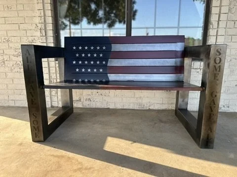 Custom steel American flag bench with patriotic design and personalized cutout sides.
