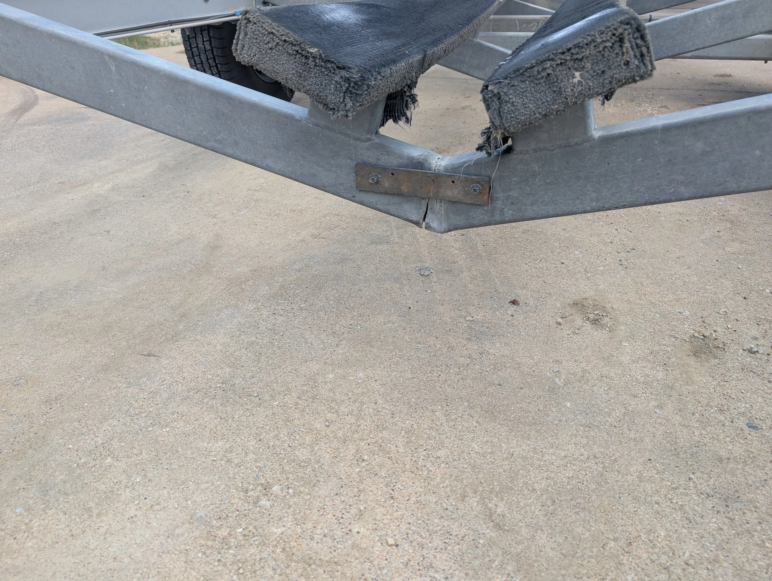 Cracked aluminum boat trailer support beam before mobile welding repair by JH Tig Works LLC.