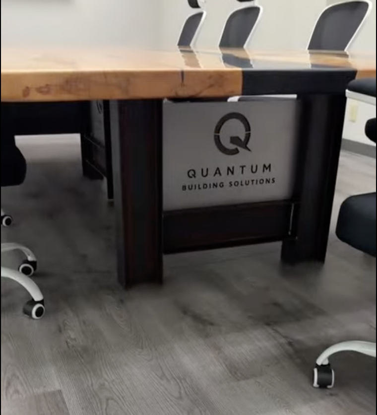Finished commercial conference table with custom fabricated steel base