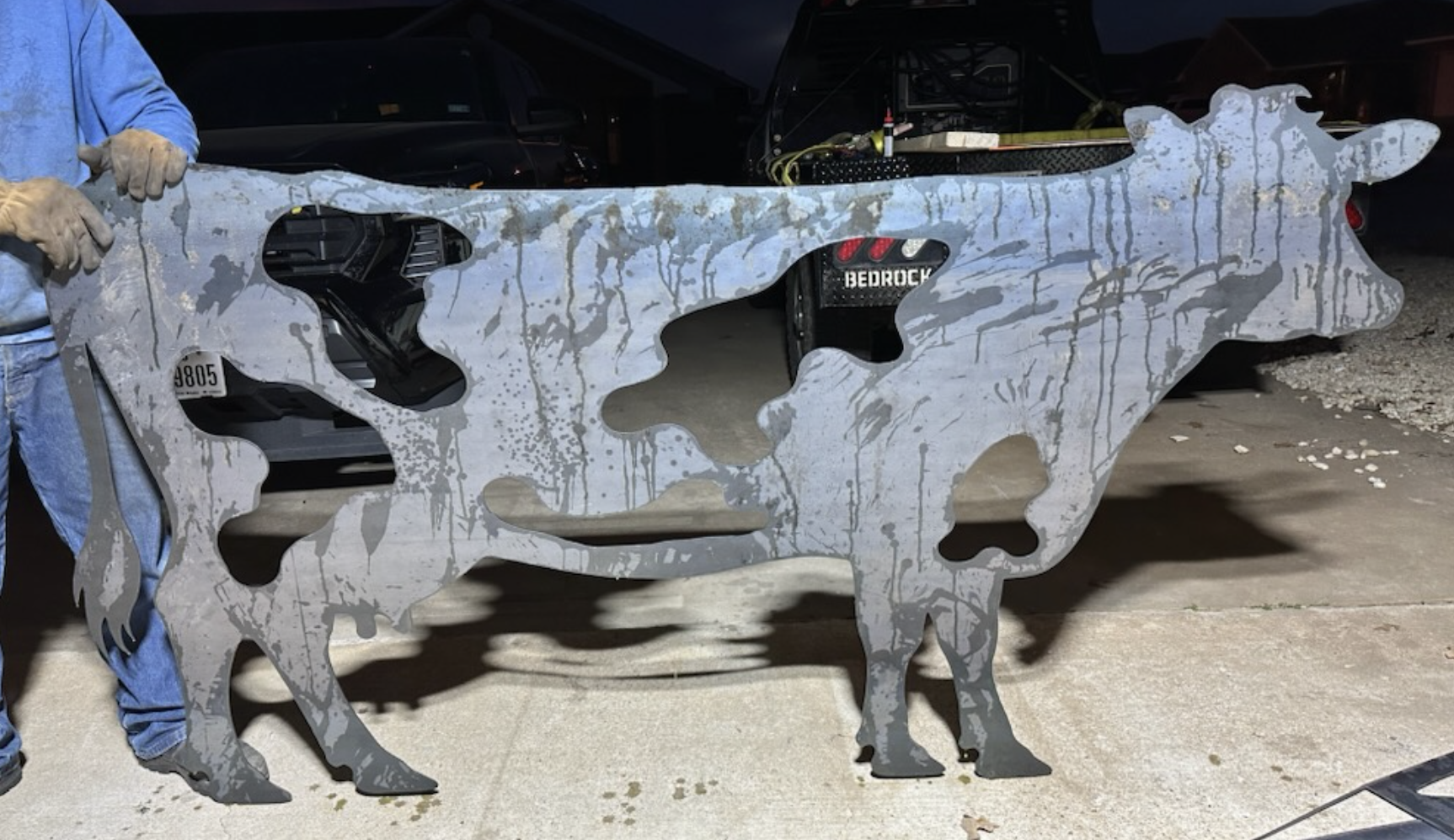 Large custom CNC cut steel cow silhouette fabricated from plate steel by JH Tig Works.