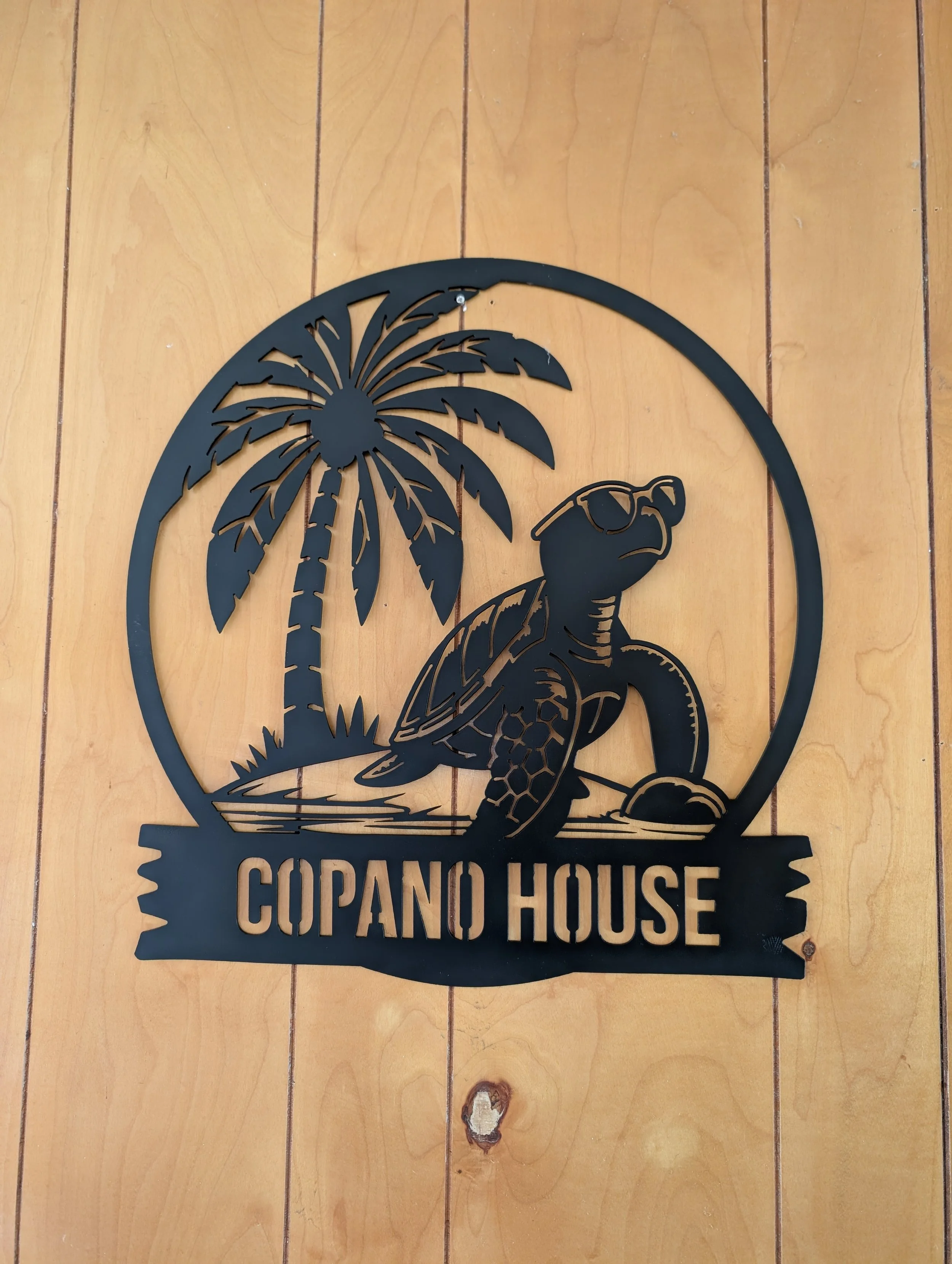 Custom CNC plasma cut steel sea turtle beach house sign with palm tree and Copano House lettering.