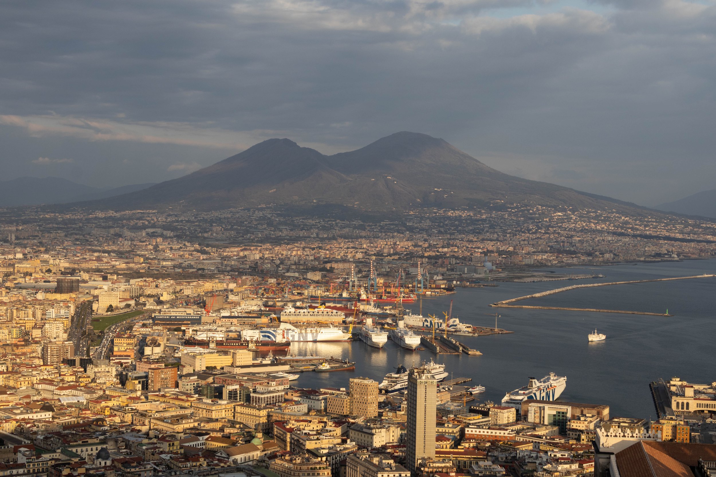 Naples, Italy | Mount Vesuvius rises above Naples and the Bay of Naples, viewed from Castle Sant'Elmo. 