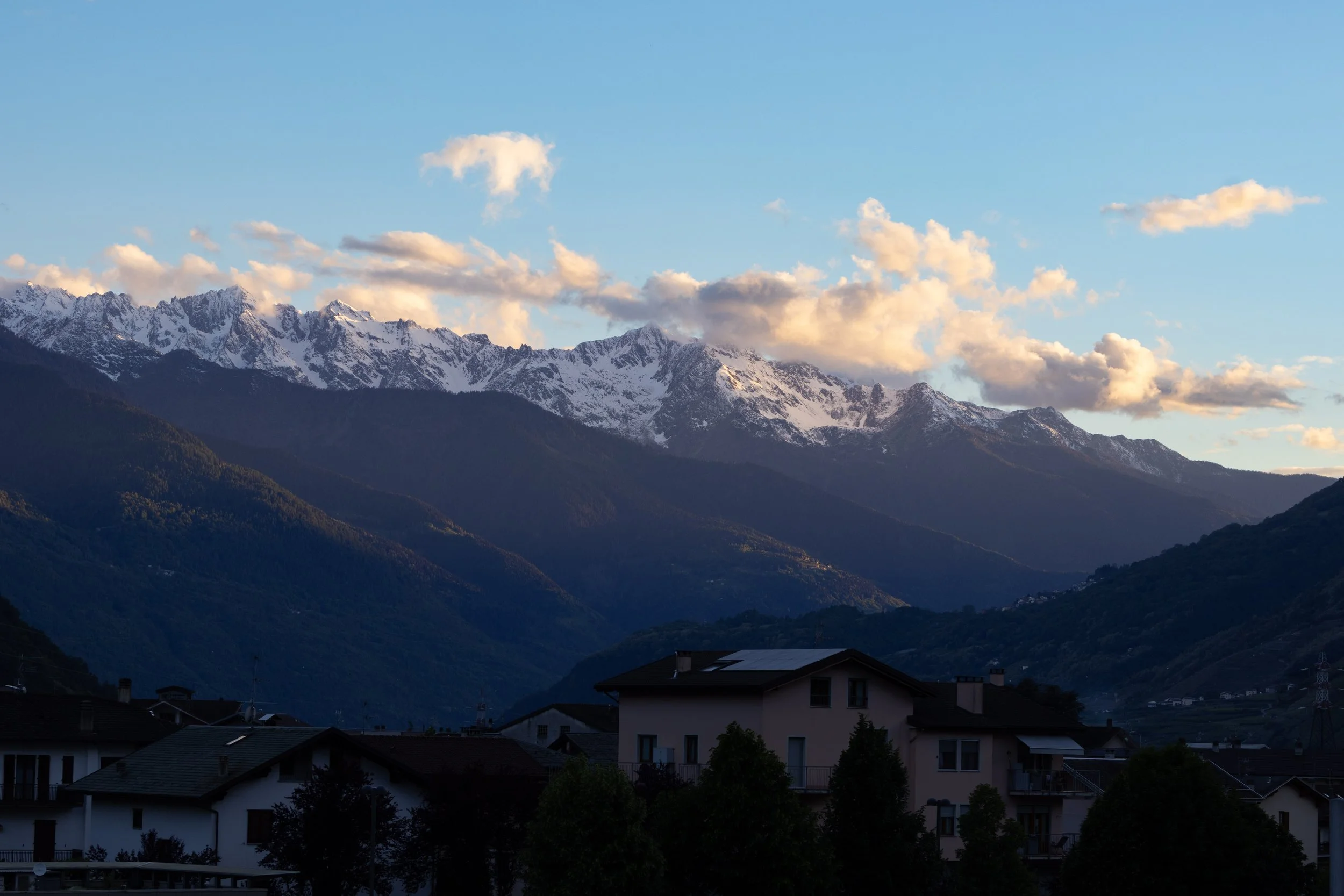 Tirano, Italy | Snow-covered mountains rise above the valley in Tirano.
