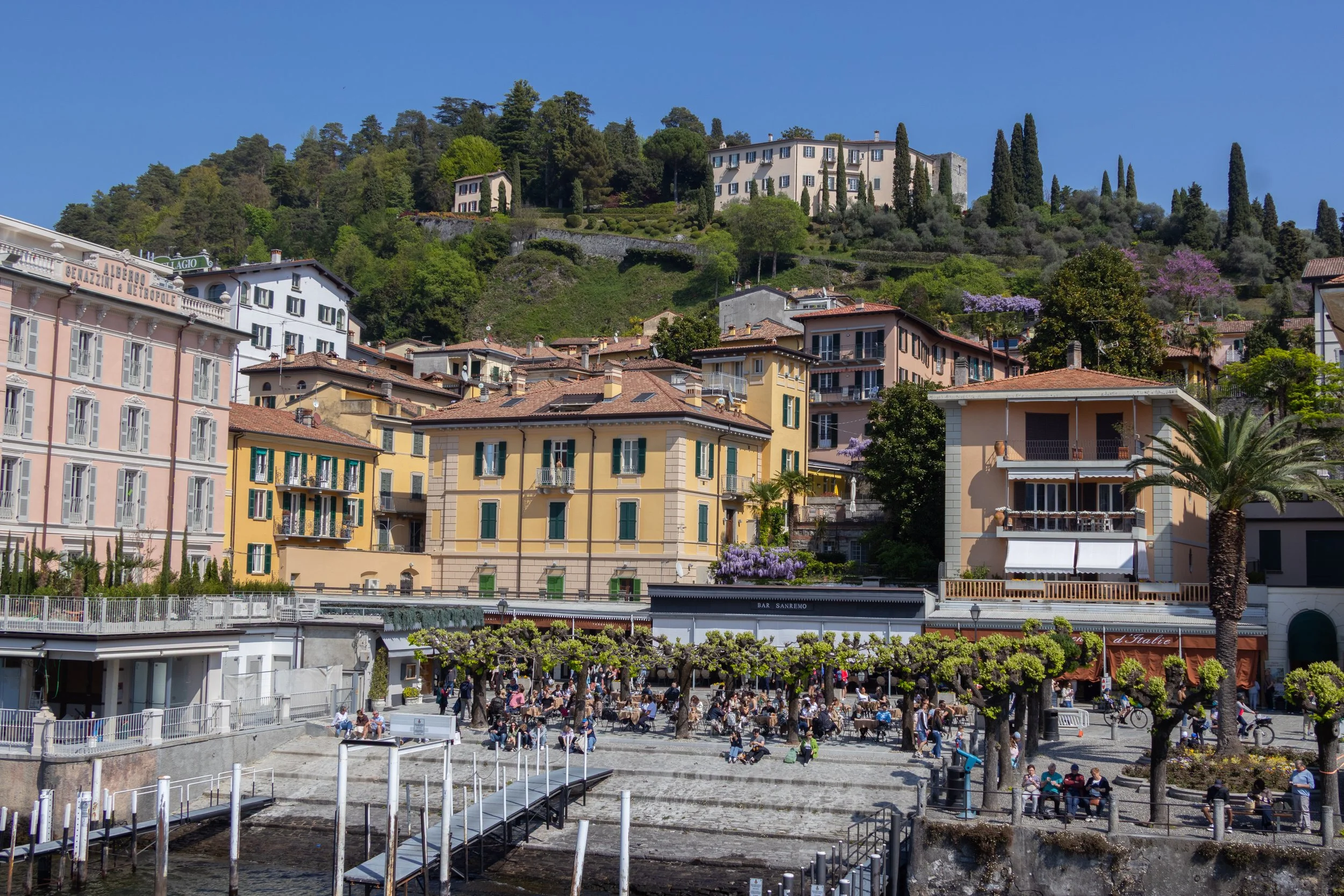 Bellagio, Italy | Colorful buildings and hillside gardens overlooking the waterfront in Bellagio. 
