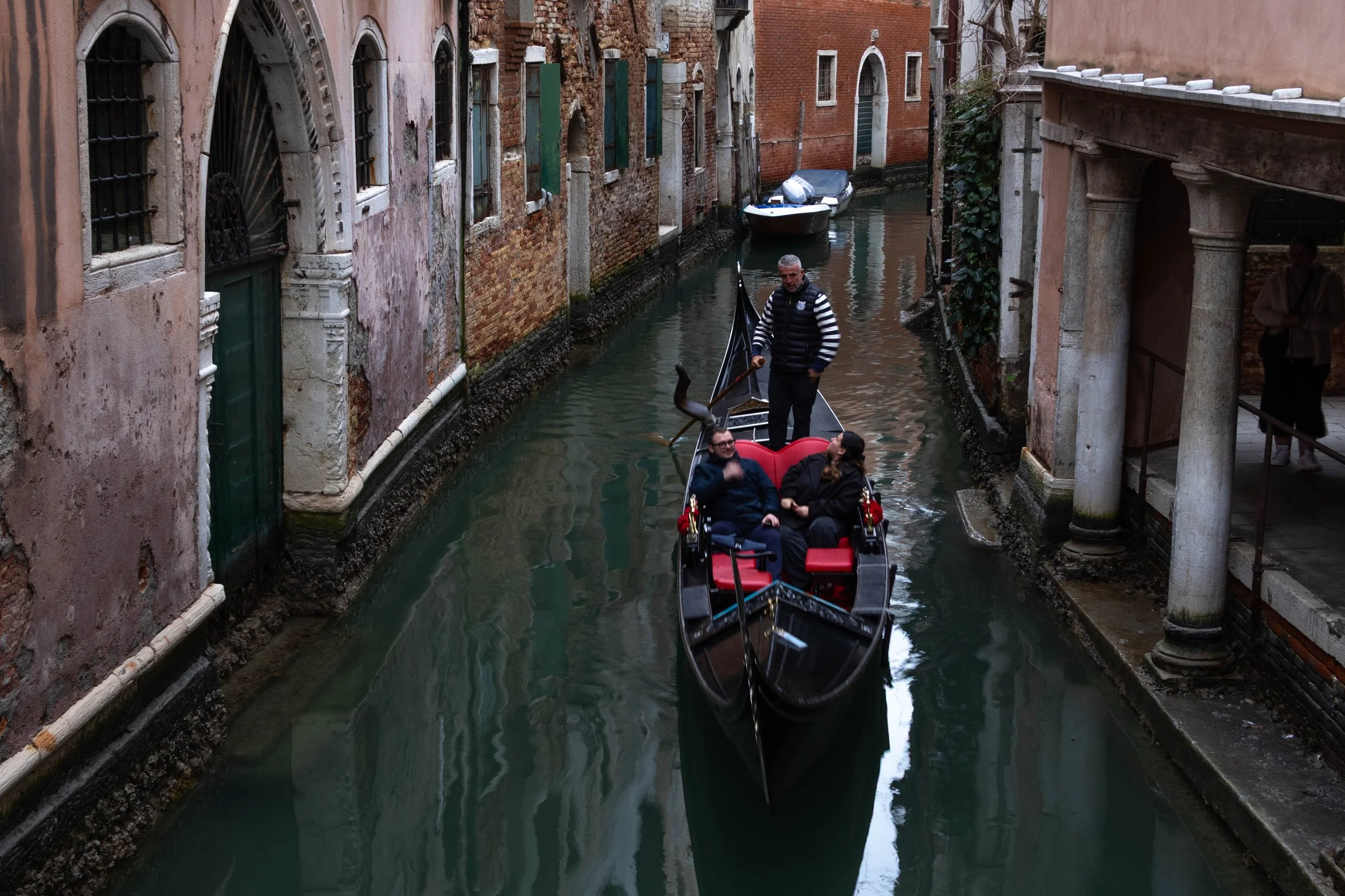 Venice, Italy | A gondola travels through one of Venice's historic canals. 