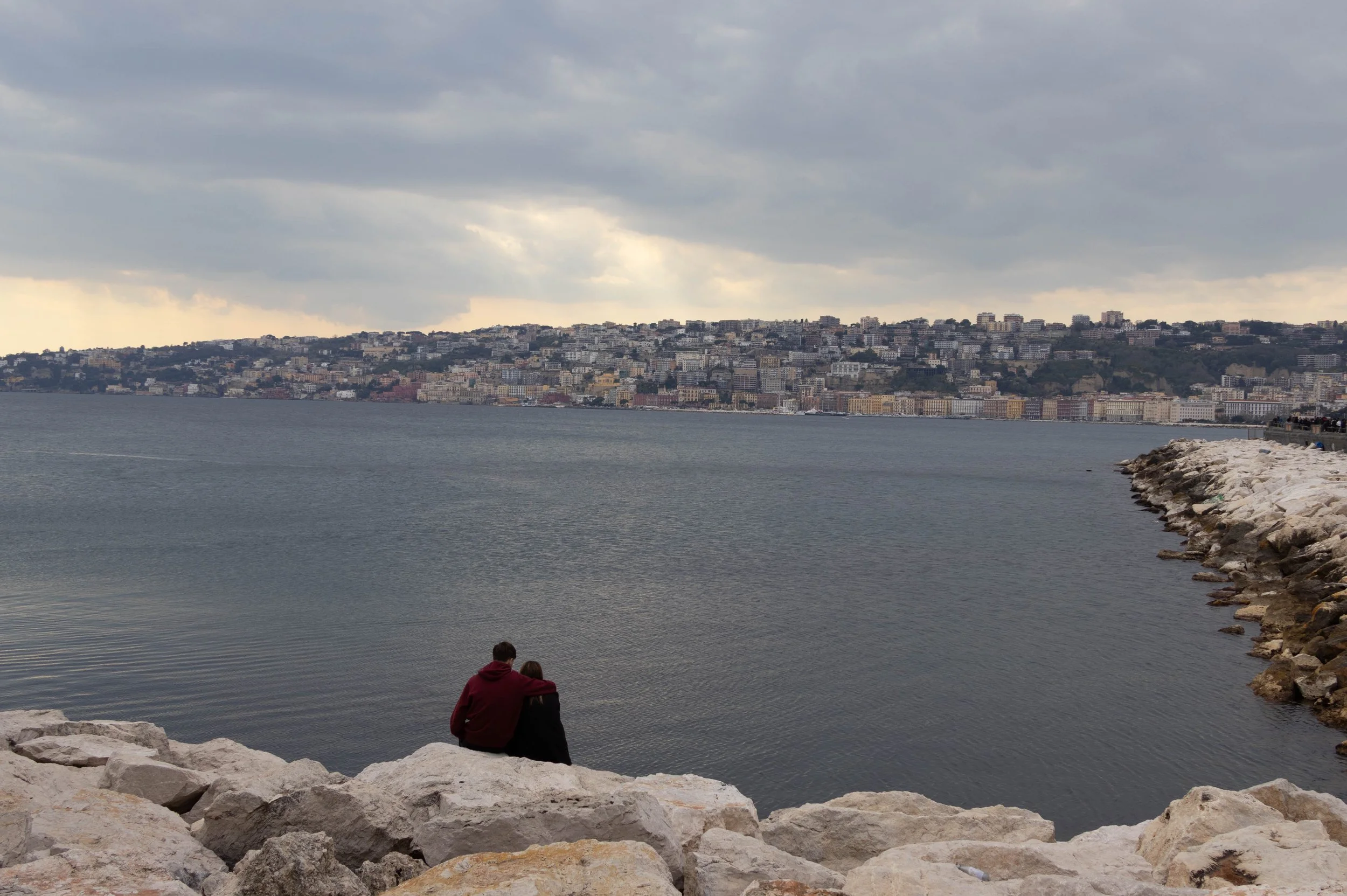 Naples, Italy | A quiet view across the Bay of Naples, with the city stretching along the distant shoreline. 