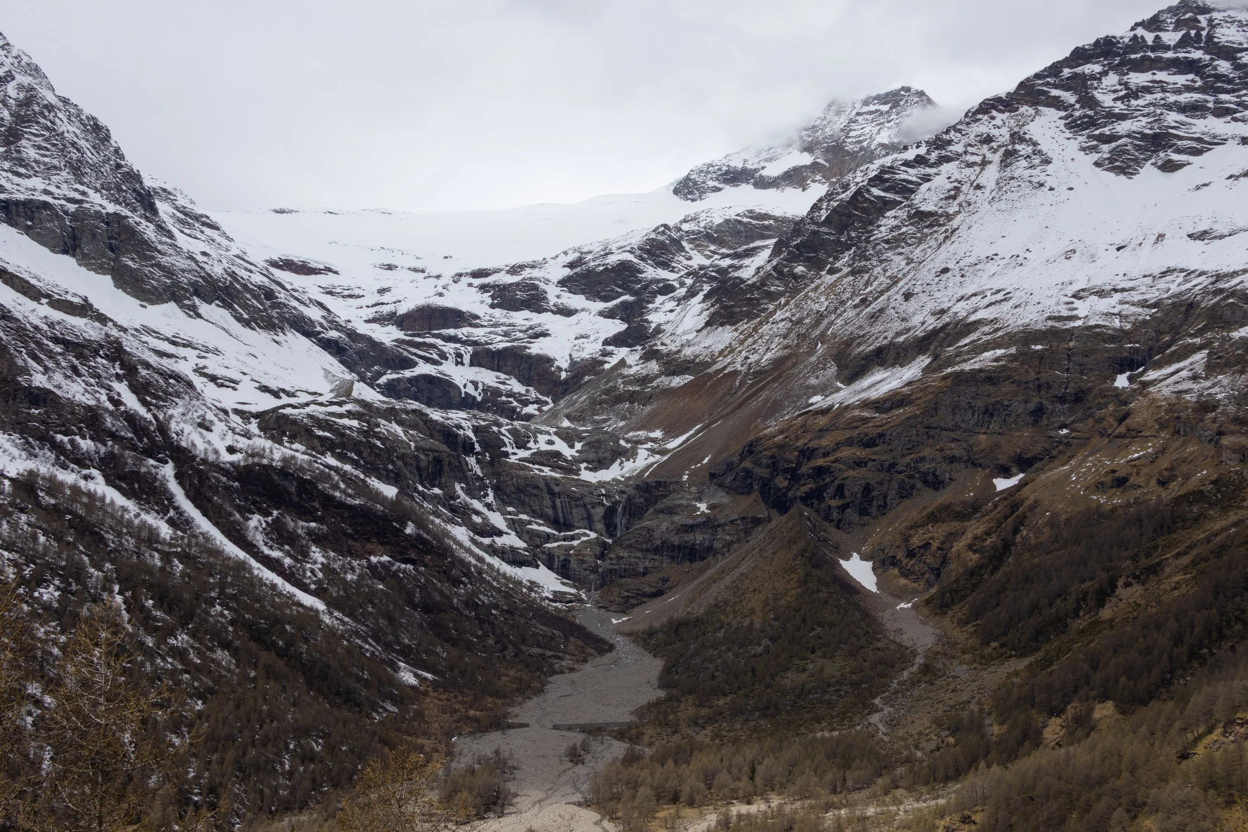 Alp Grum, Switzerland | A sweeping view of the rugged alpine landscape.