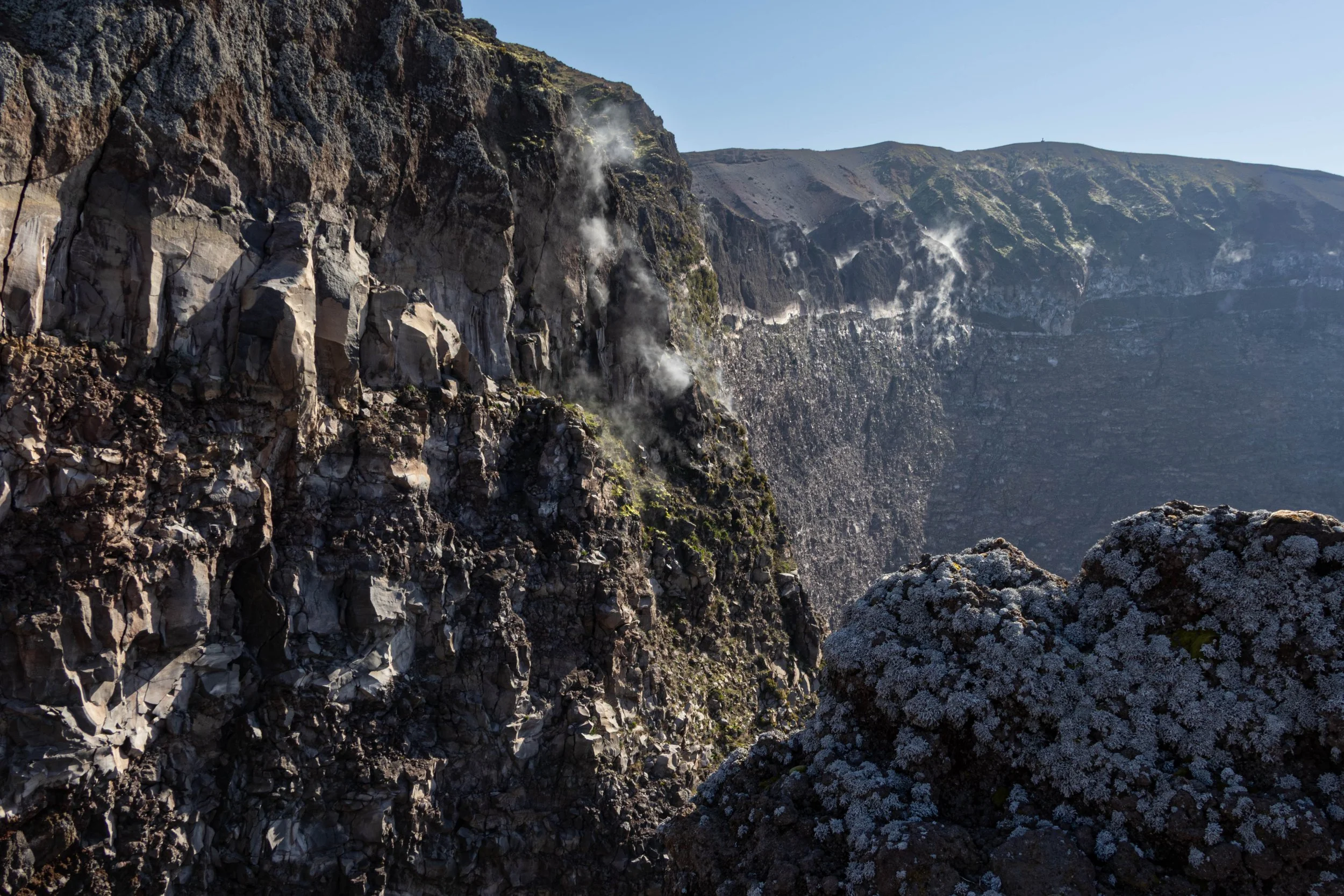 Naples, Italy | Steam rises from the volcanic cliffs inside the crater of Mount Vesuvius.