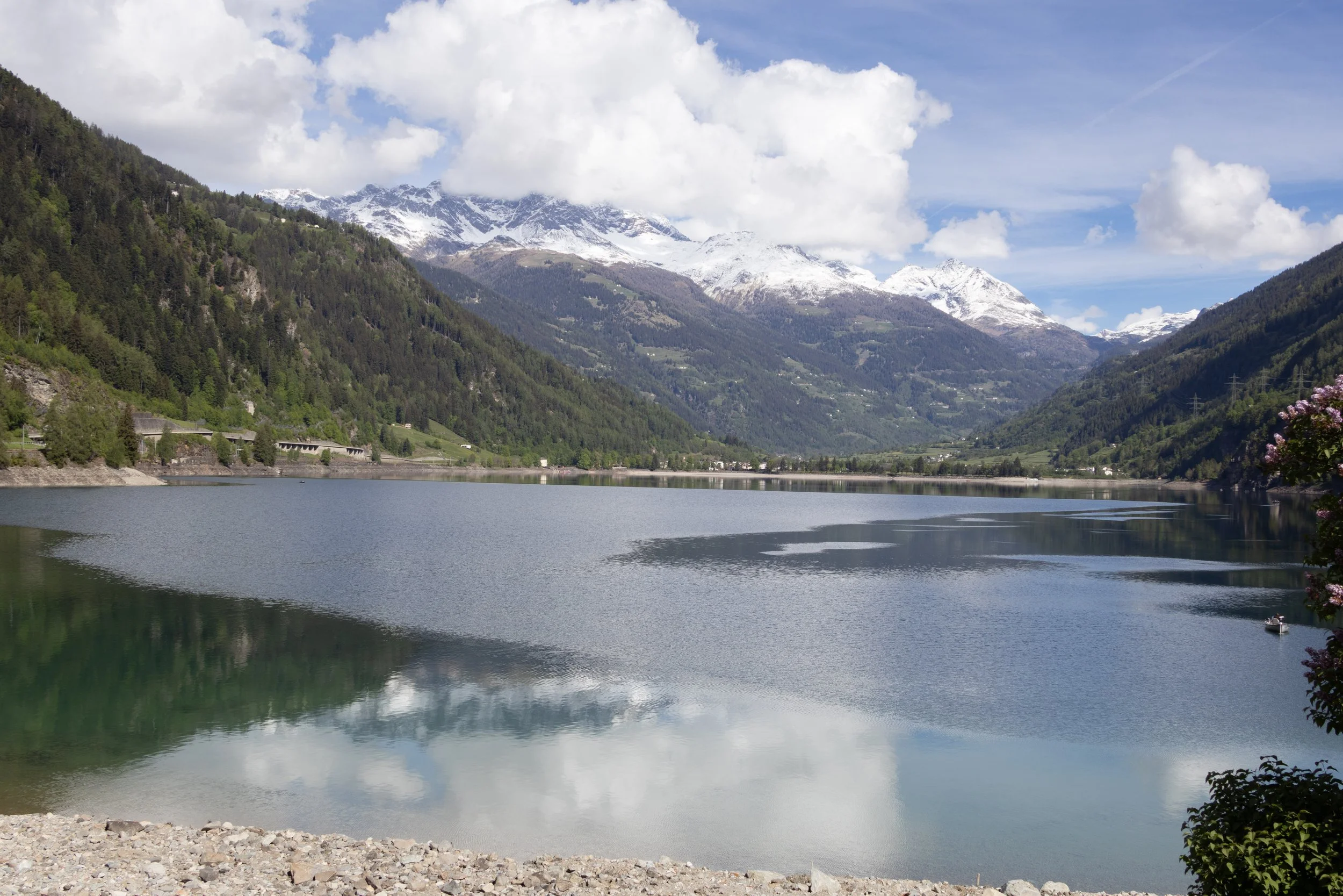 Mirror Lake, Switzerland | The surrounding mountains and clouds reflected in the calm waters of Mirror Lake.