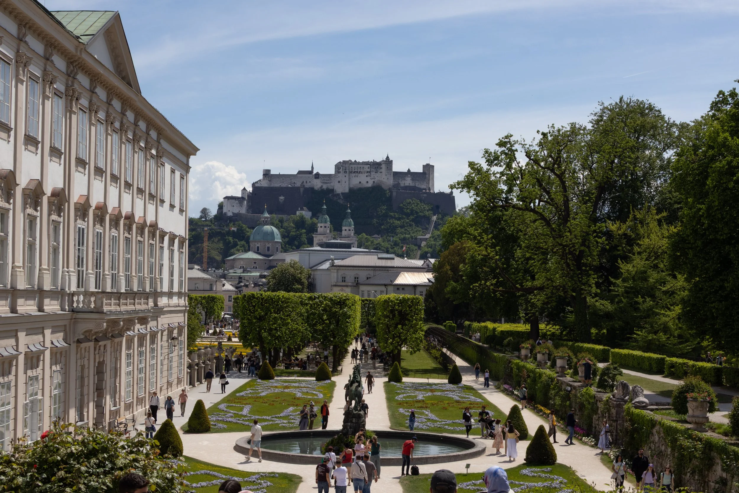 Salzburg, Austria | Mirabell Gardens with Hohensalzburg Fortress overlooking the city. 