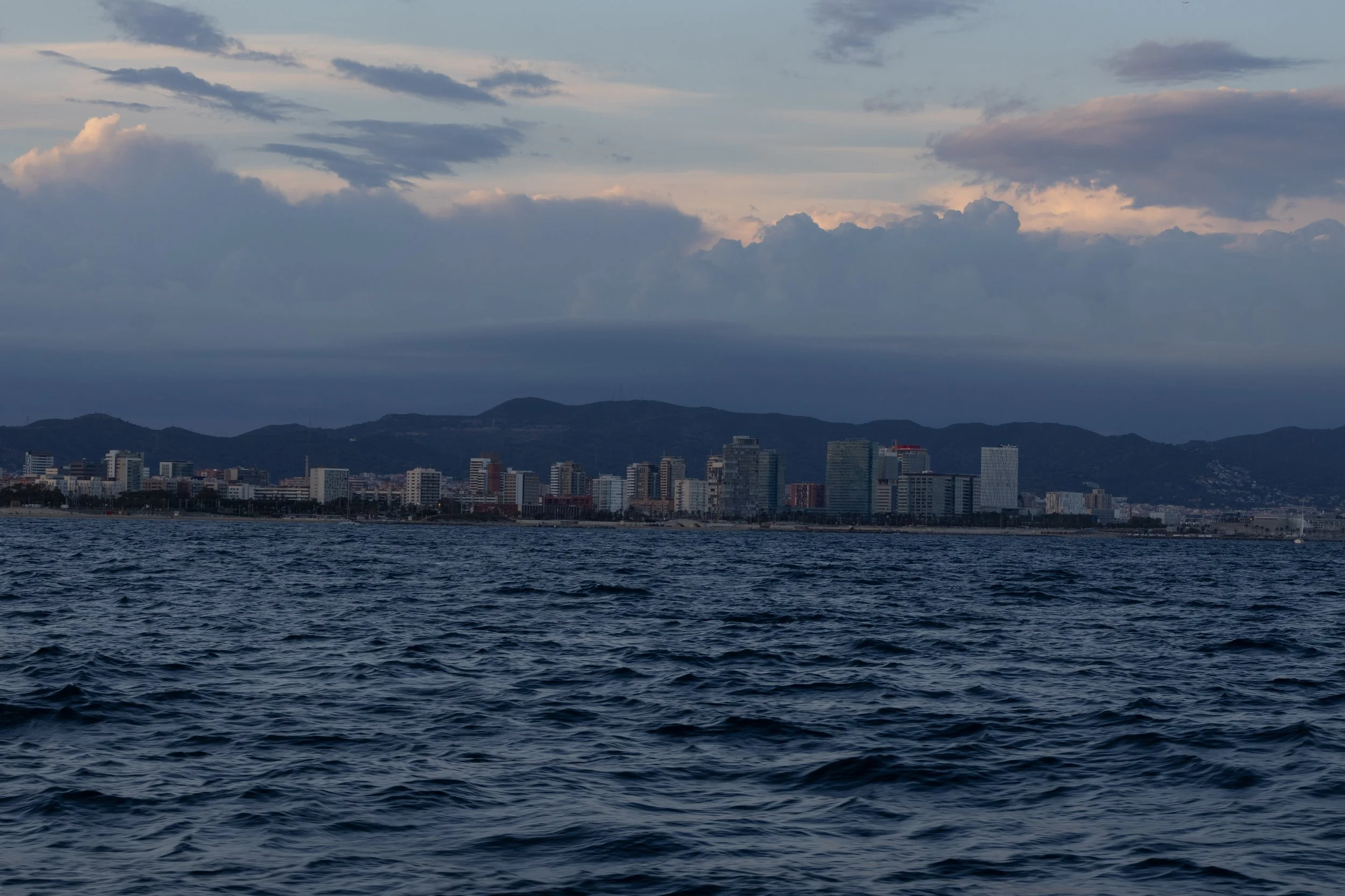 Barcelona, Spain | Evening clouds gather over Barcelona's waterfront. 